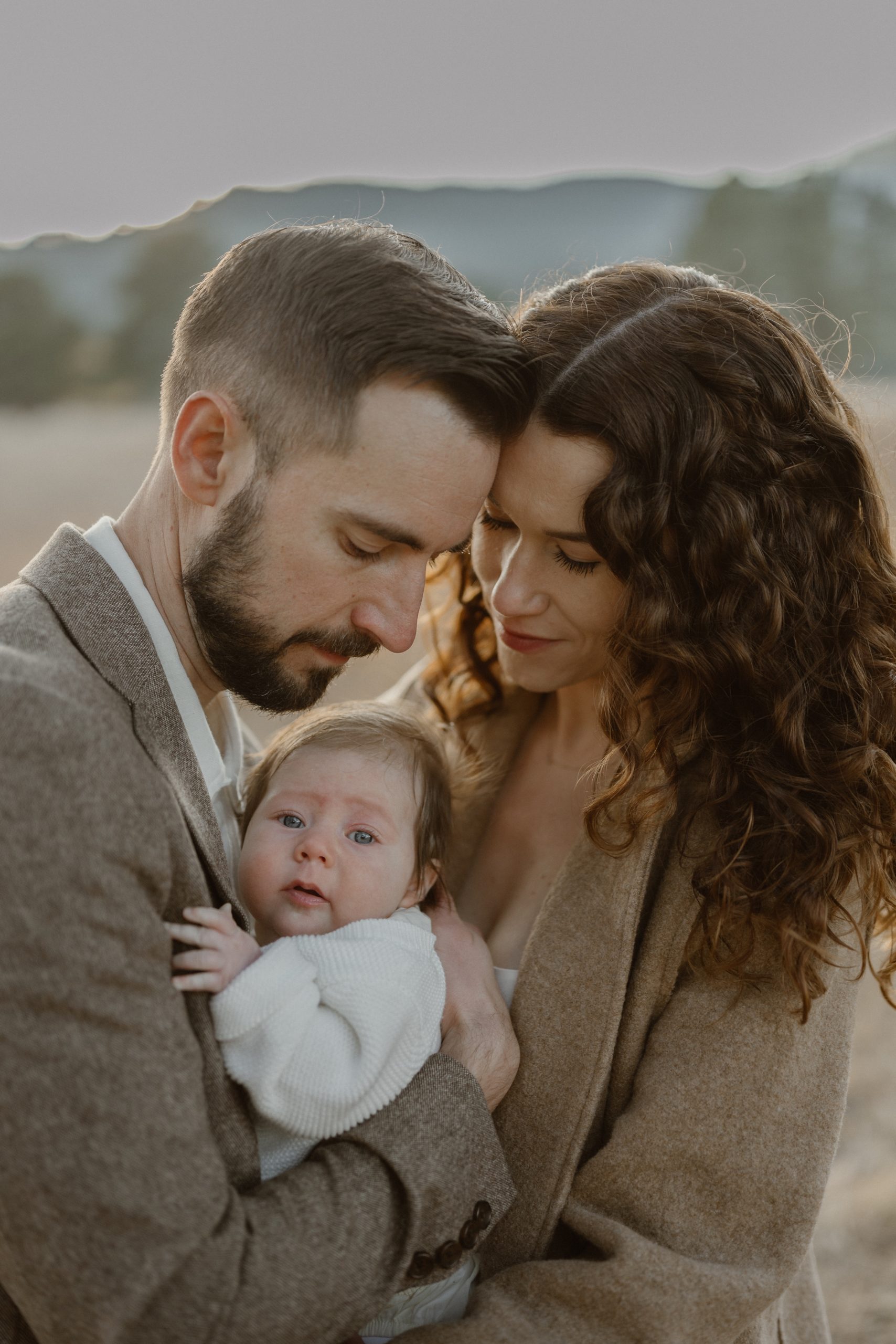 Anti-bride inspired intimate elopement on a fall evening in Evergreen, Colorado. The couple danced in the grass fields together with their newborn baby for their intimate elopement. Photos by Durango wedding photographer, Ashley Joyce Photography.