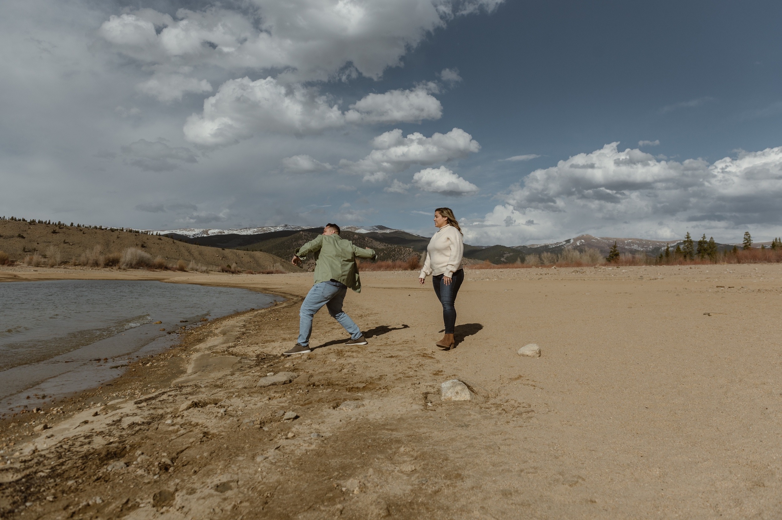 A couple poses for their Twin Lakes engagement photos at Twin Lakes, Colorado. Photo by Denver elopement photographer, Ashley Joyce Photography.