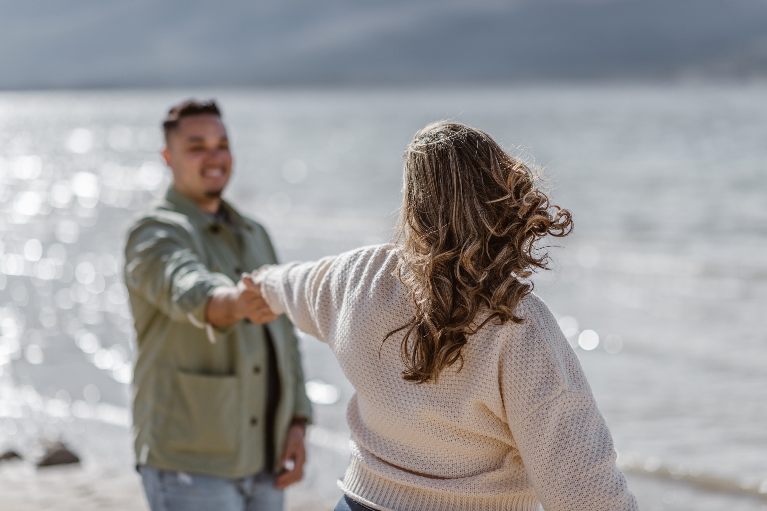 A couple poses for their Twin Lakes engagement photos at Twin Lakes, Colorado. Photo by Denver elopement photographer, Ashley Joyce Photography.