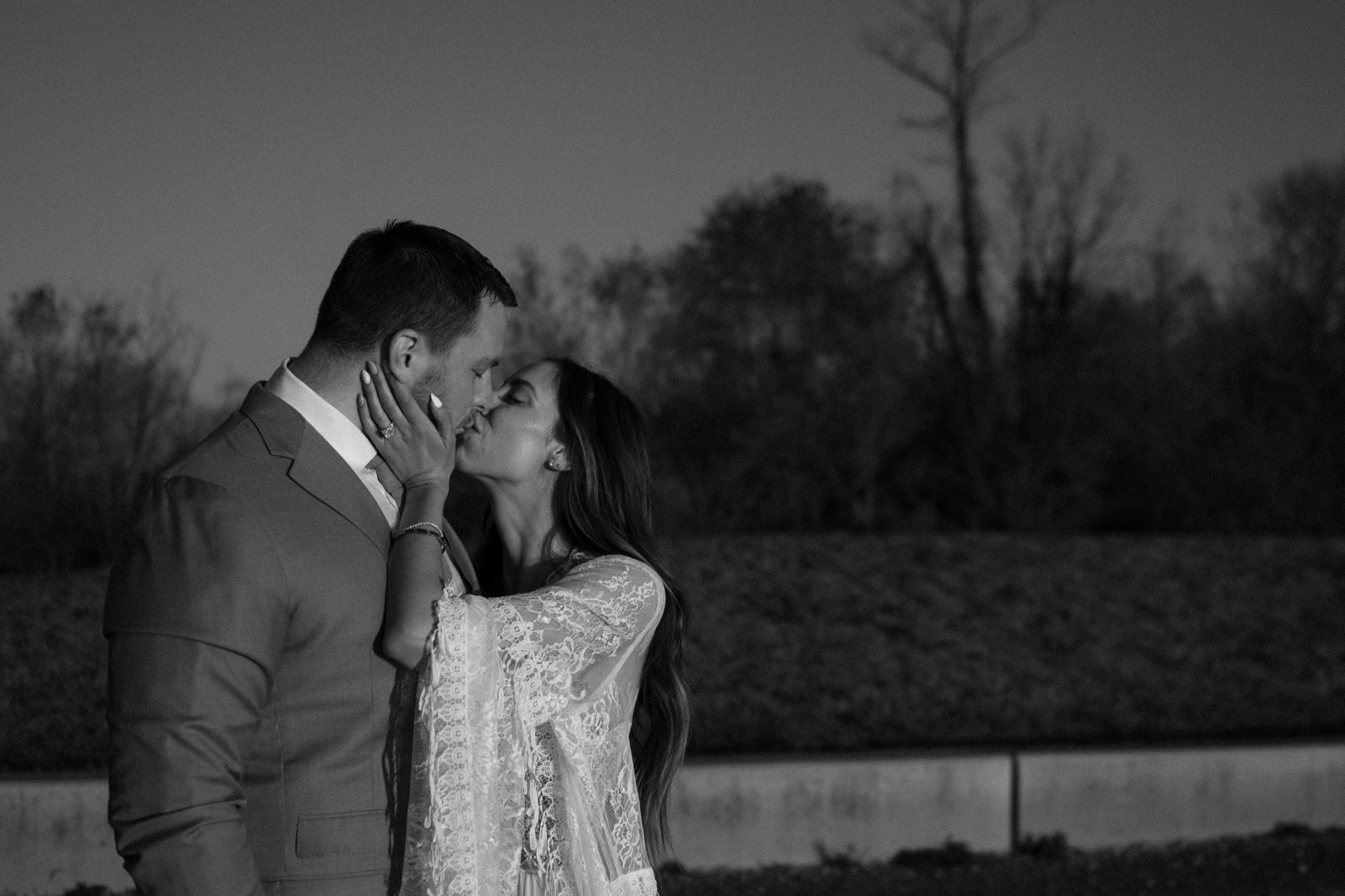 A married couple poses for their Alexandria, Virginia wedding anniversary photo session at Jones Point Park with Colorado photographer, Ashley Joyce Photography. Copyright Ashley Joyce Photography 2022.