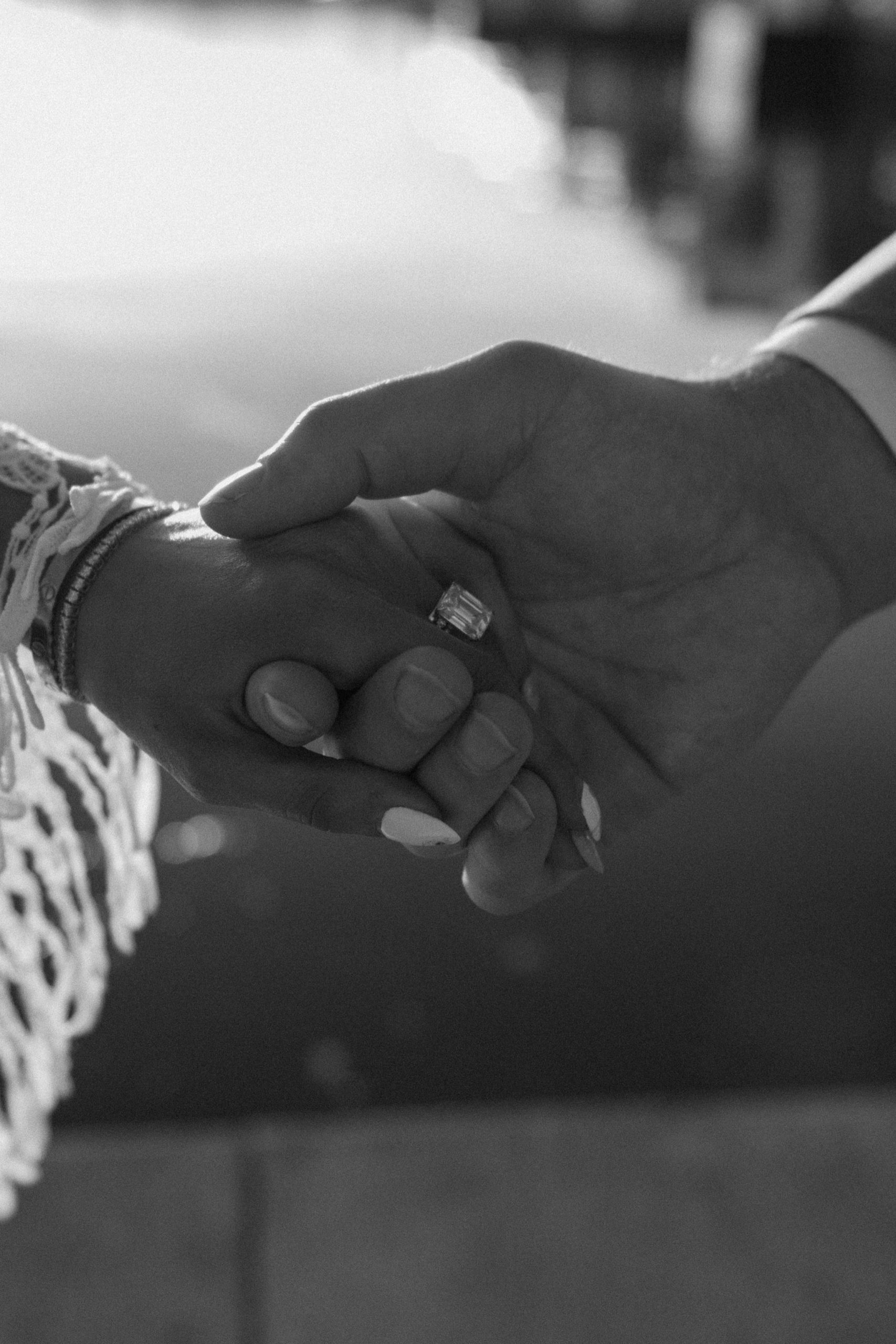 A married couple poses for their Alexandria, Virginia wedding anniversary photo session at Jones Point Park with Colorado photographer, Ashley Joyce Photography. Copyright Ashley Joyce Photography 2022.