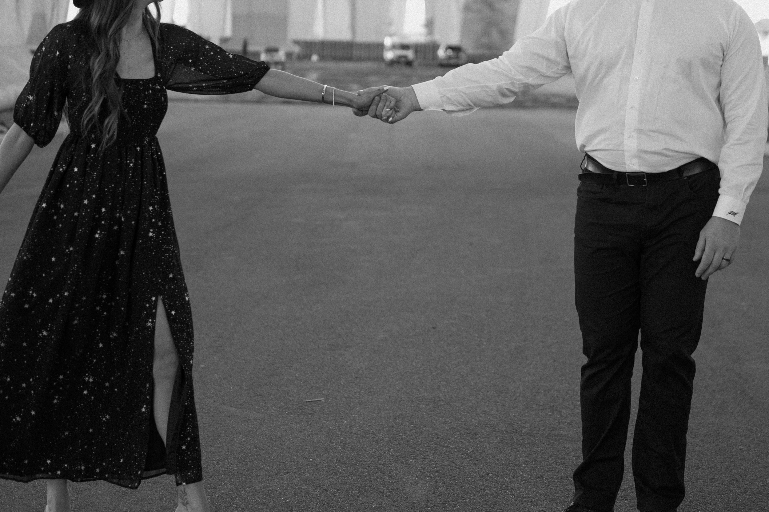 A married couple poses for their Alexandria, Virginia wedding anniversary photo session at Jones Point Park with Colorado photographer, Ashley Joyce Photography. Copyright Ashley Joyce Photography 2022.