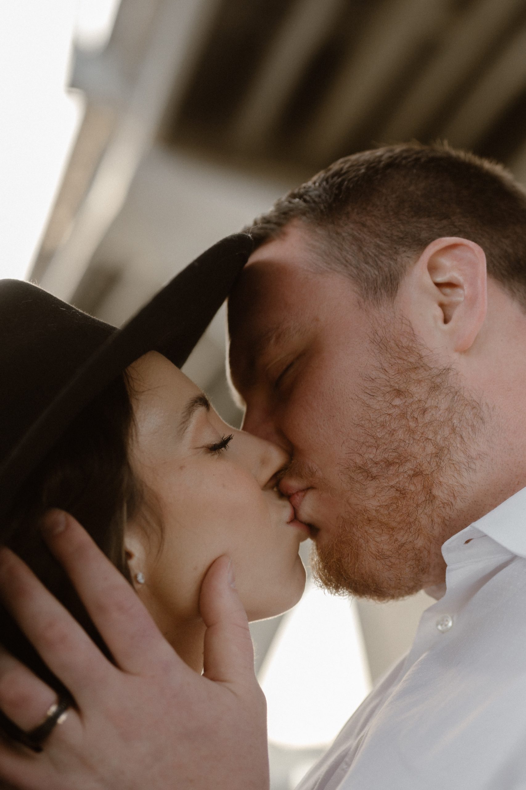 A married couple poses for their Alexandria, Virginia wedding anniversary photo session at Jones Point Park with Colorado photographer, Ashley Joyce Photography. Copyright Ashley Joyce Photography 2022.