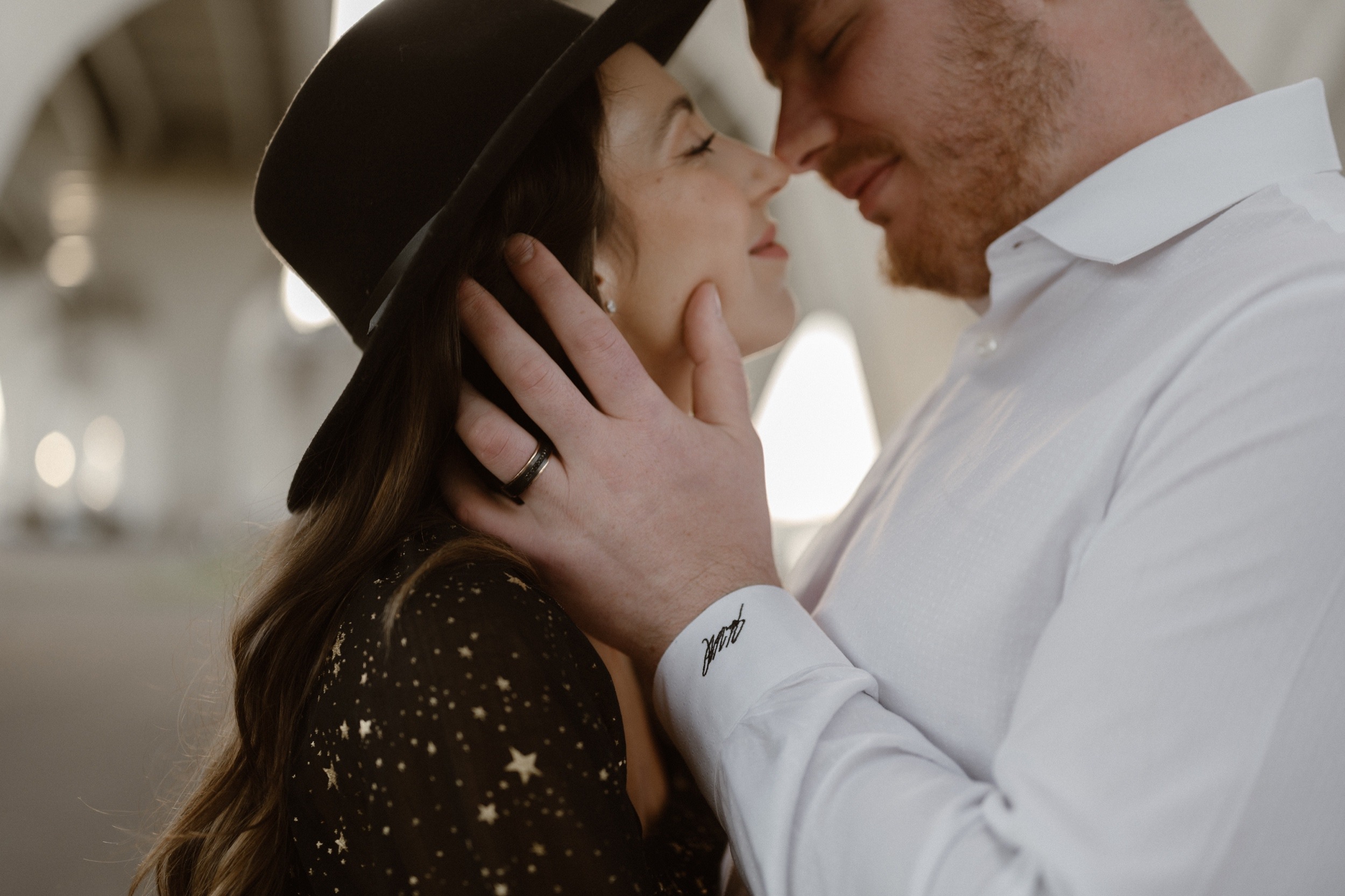 A married couple poses for their Alexandria, Virginia wedding anniversary photo session at Jones Point Park with Colorado photographer, Ashley Joyce Photography. Copyright Ashley Joyce Photography 2022.