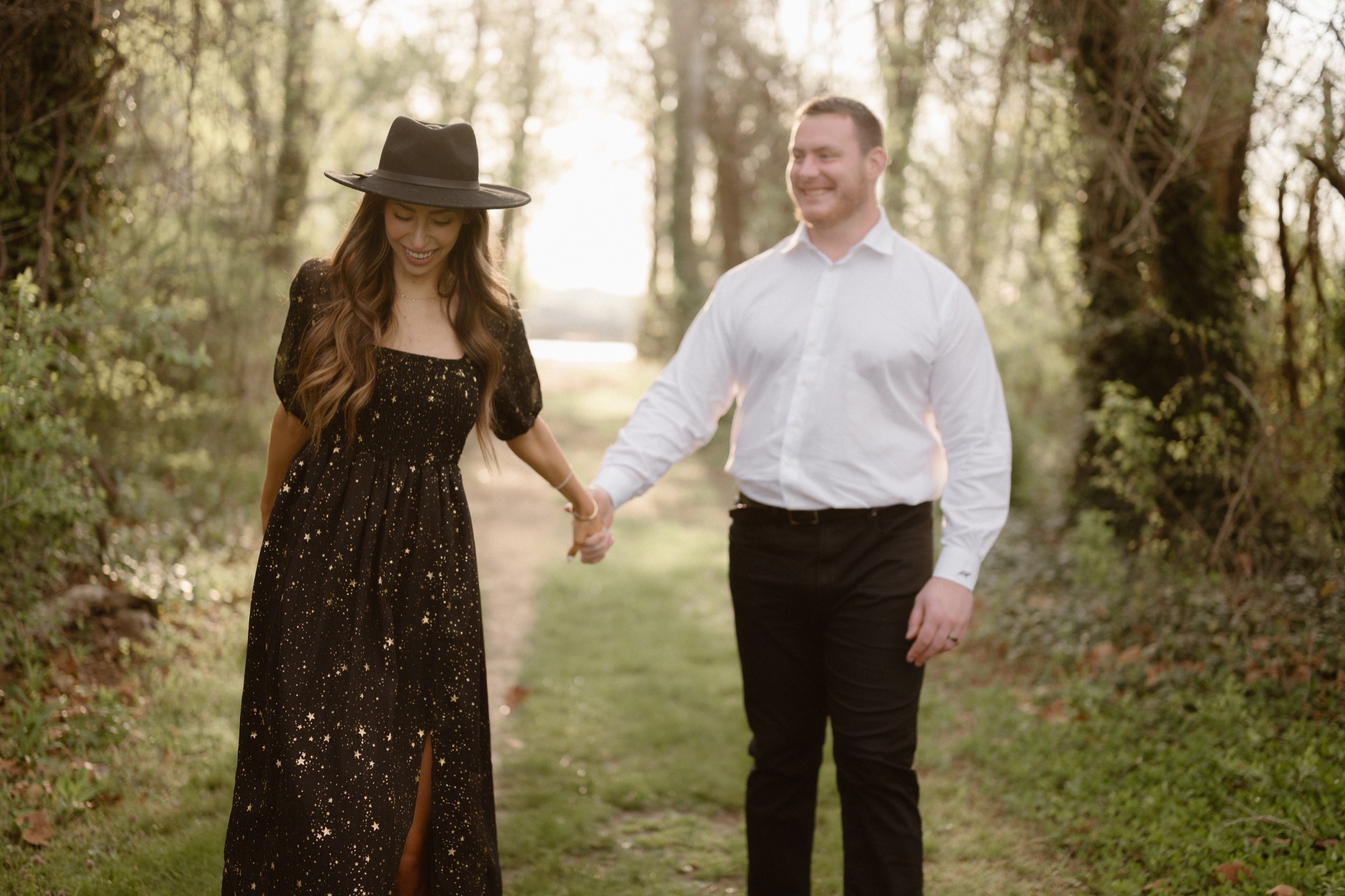 A married couple poses for their Alexandria, Virginia wedding anniversary photo session at Jones Point Park with Colorado photographer, Ashley Joyce Photography. Copyright Ashley Joyce Photography 2022.