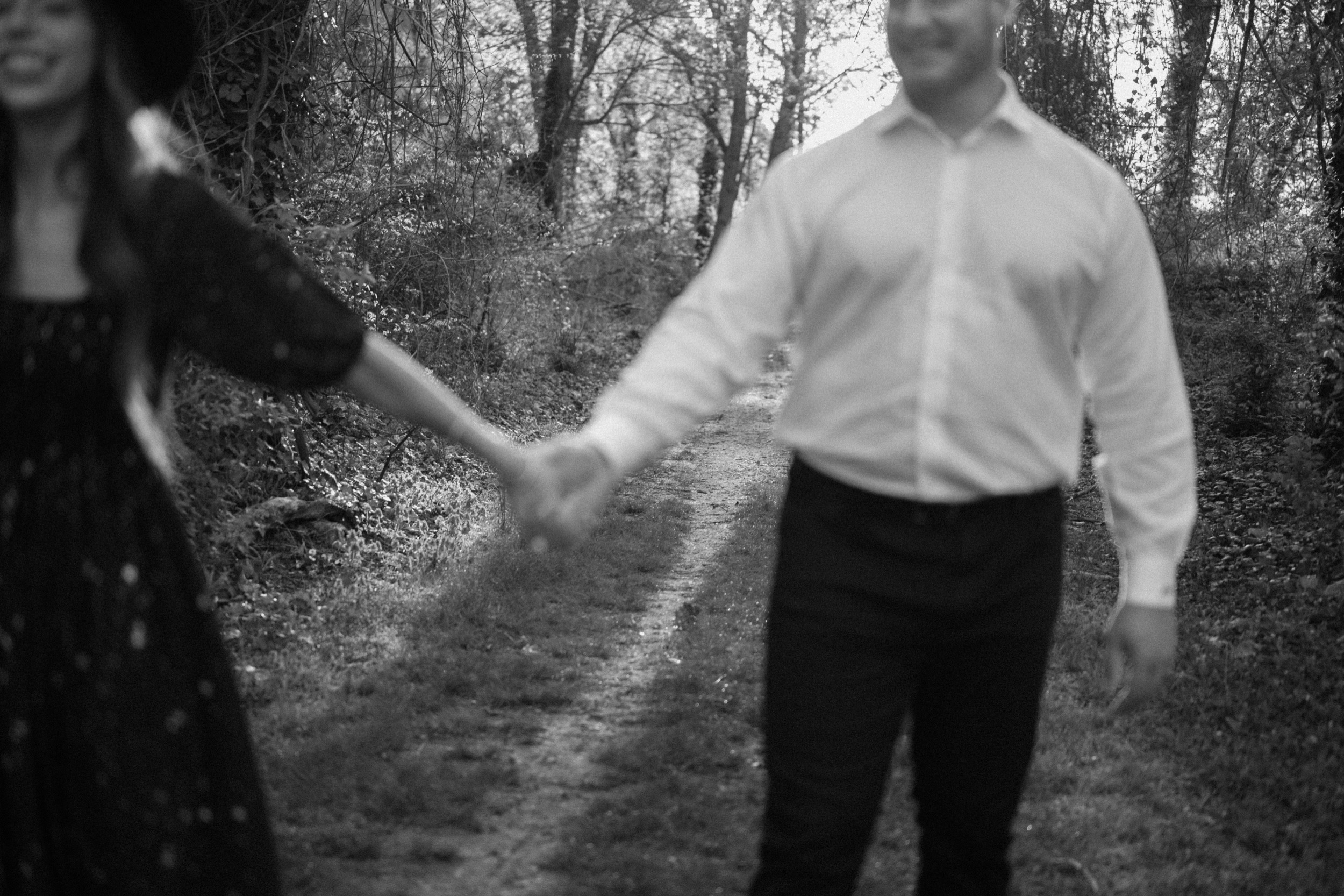A married couple poses for their Alexandria, Virginia wedding anniversary photo session at Jones Point Park with Colorado photographer, Ashley Joyce Photography. Copyright Ashley Joyce Photography 2022.