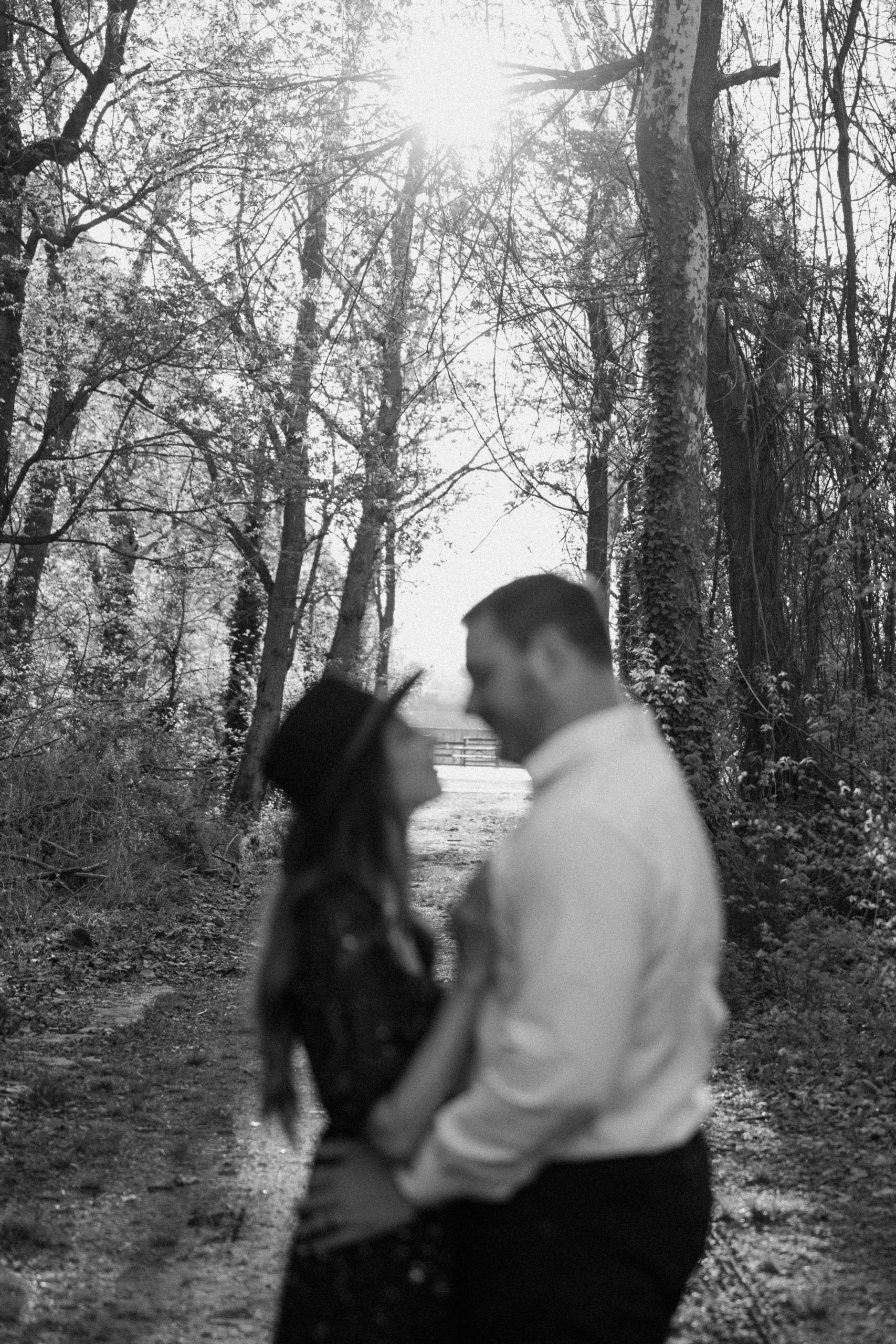 A married couple poses for their Alexandria, Virginia wedding anniversary photo session at Jones Point Park with Colorado photographer, Ashley Joyce Photography. Copyright Ashley Joyce Photography 2022.