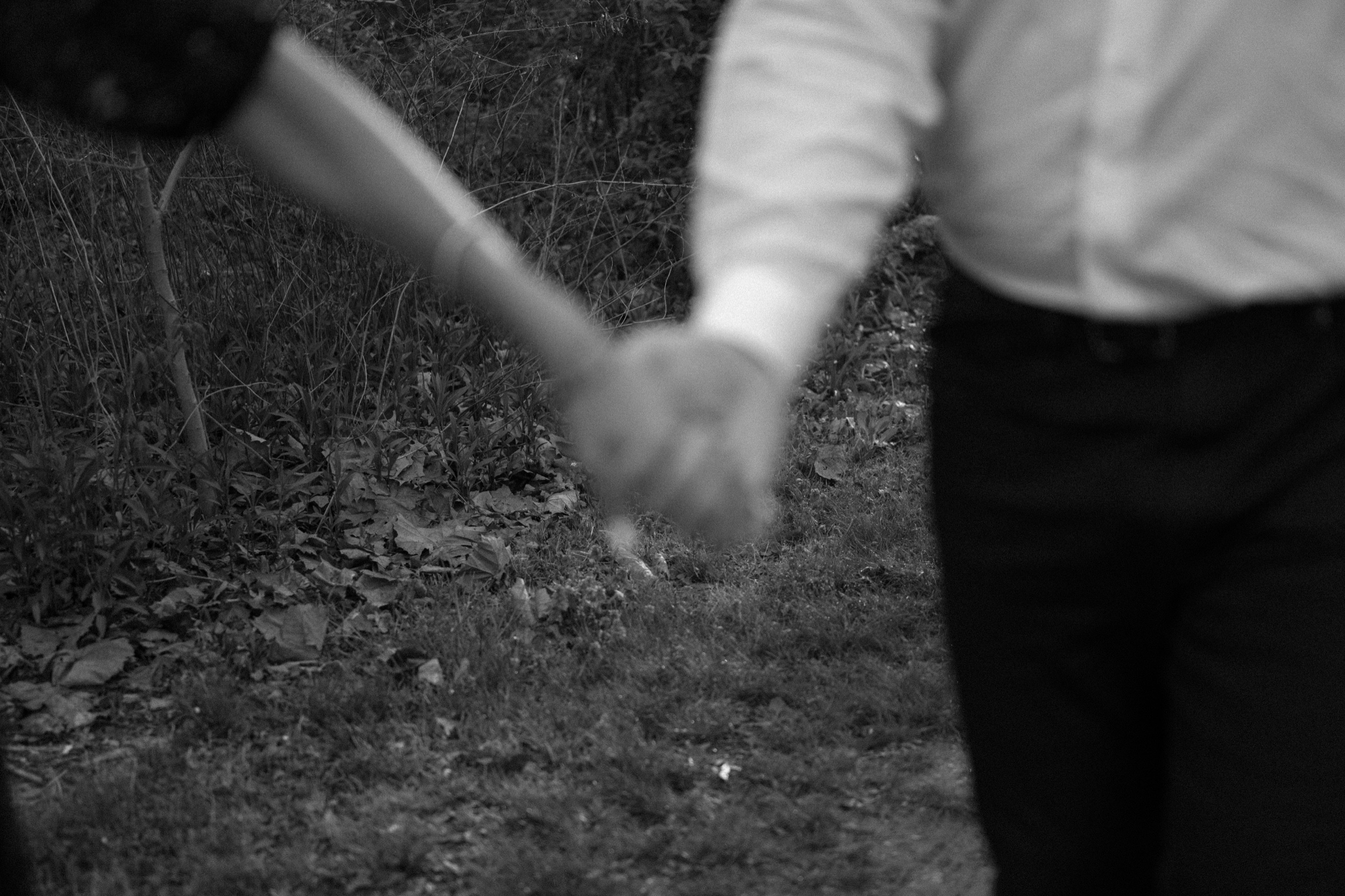 A married couple poses for their Alexandria, Virginia wedding anniversary photo session at Jones Point Park with Colorado photographer, Ashley Joyce Photography. Copyright Ashley Joyce Photography 2022.