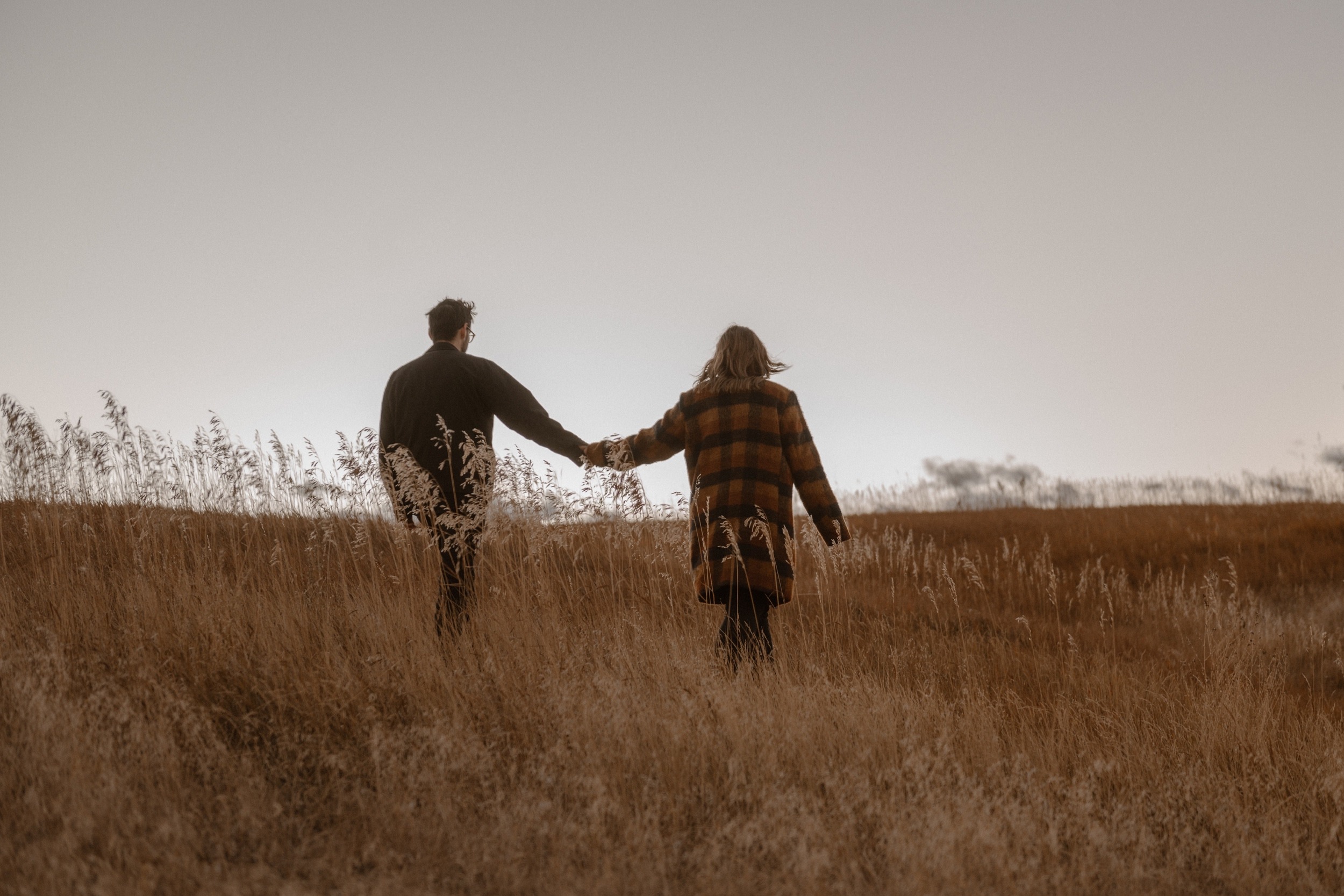 A romantic fall evening with a Colorado engaged couple as they pose for their Standley Lake engagement session. Photo by Denver Engagement photographer, Ashley Joyce Photography, copyright 2022.