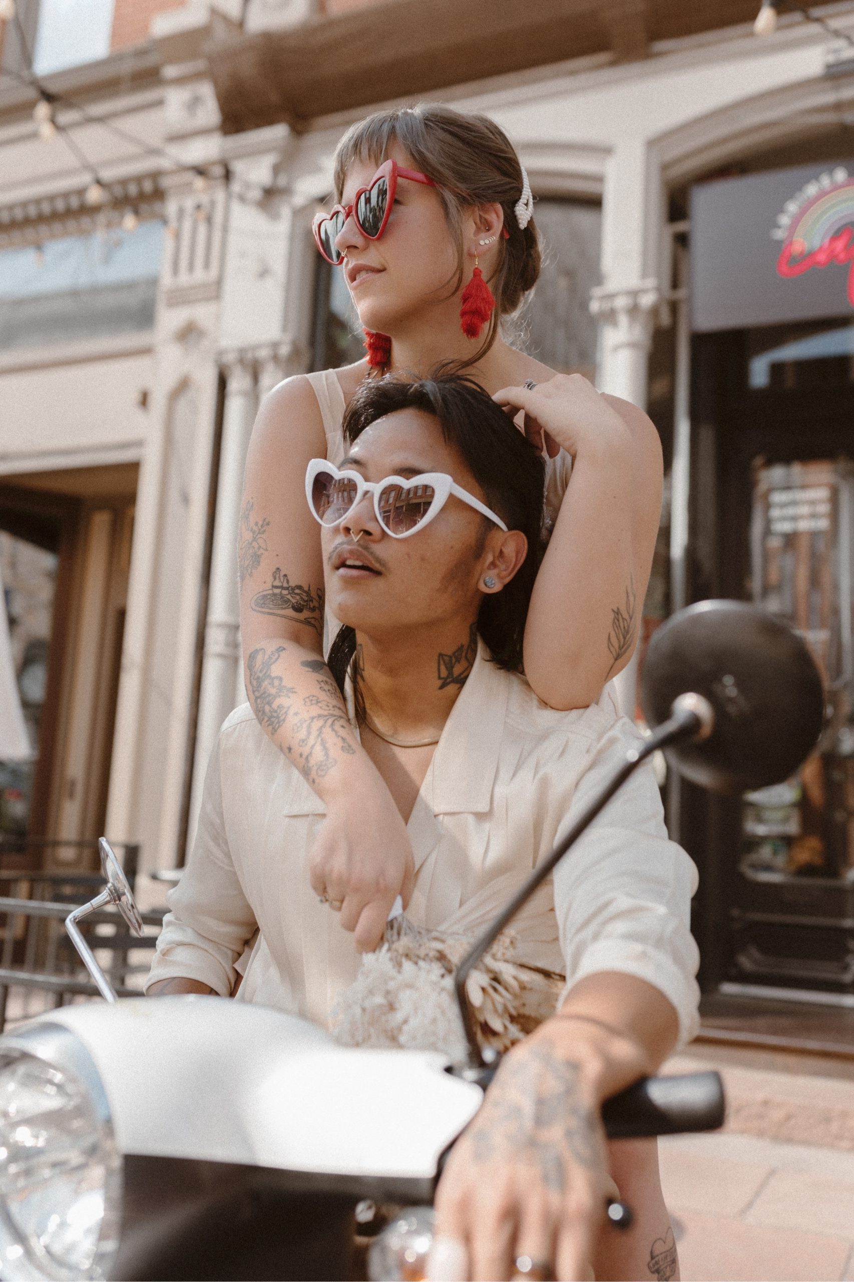 A romantic Italian-inspired downtown Denver elopement, complete with vintage outfits and an Italian scooter. Set in Larimer Square in downtown Denver. Photo by Denver elopement photographer, Ashley Joyce Photography, copyright 2022.