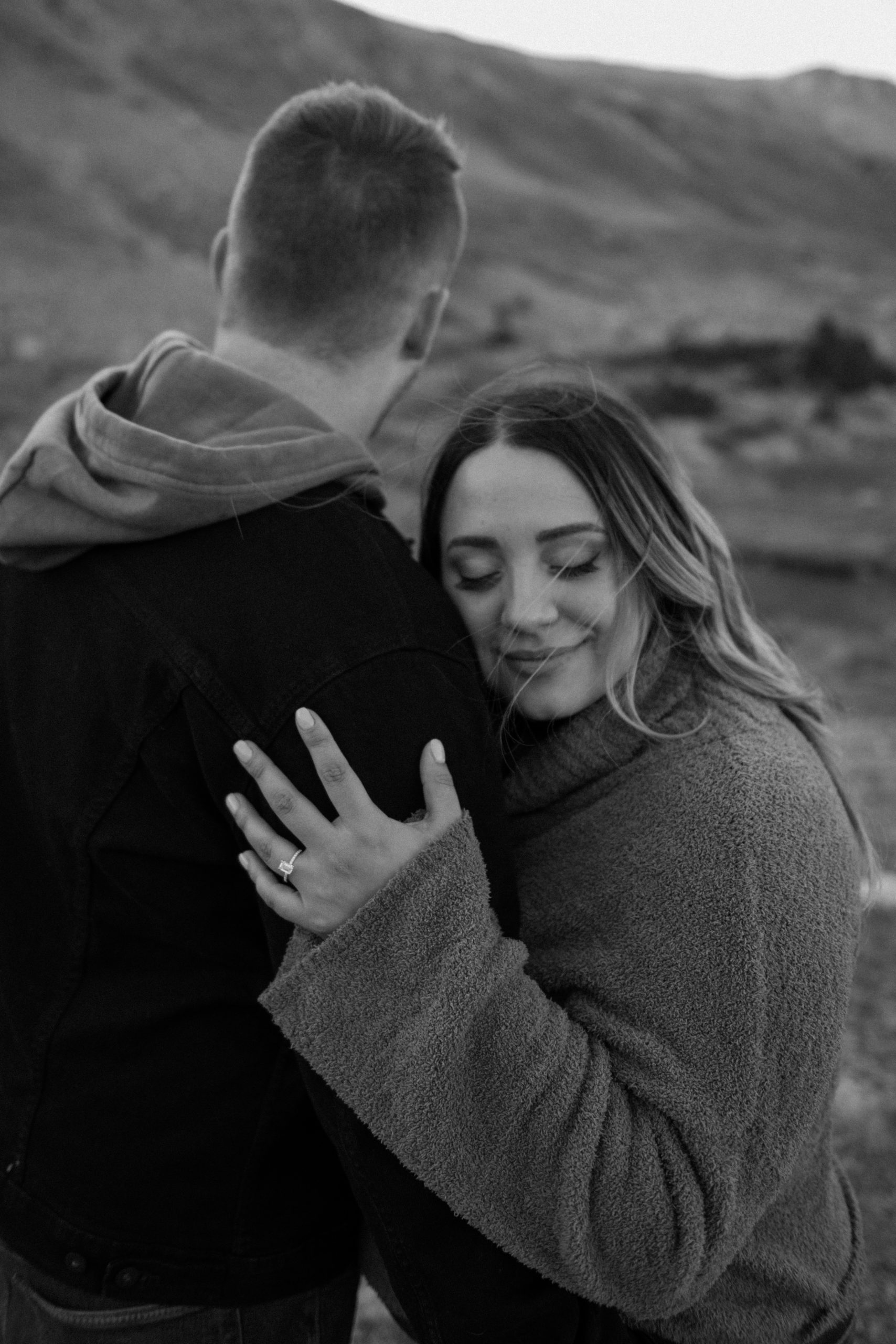 A Colorado engaged couple poses for their engagement photos at Loveland Pass, Colorado. Photos by Denver Elopement Photographer, Ashley Joyce Photography, 2022.