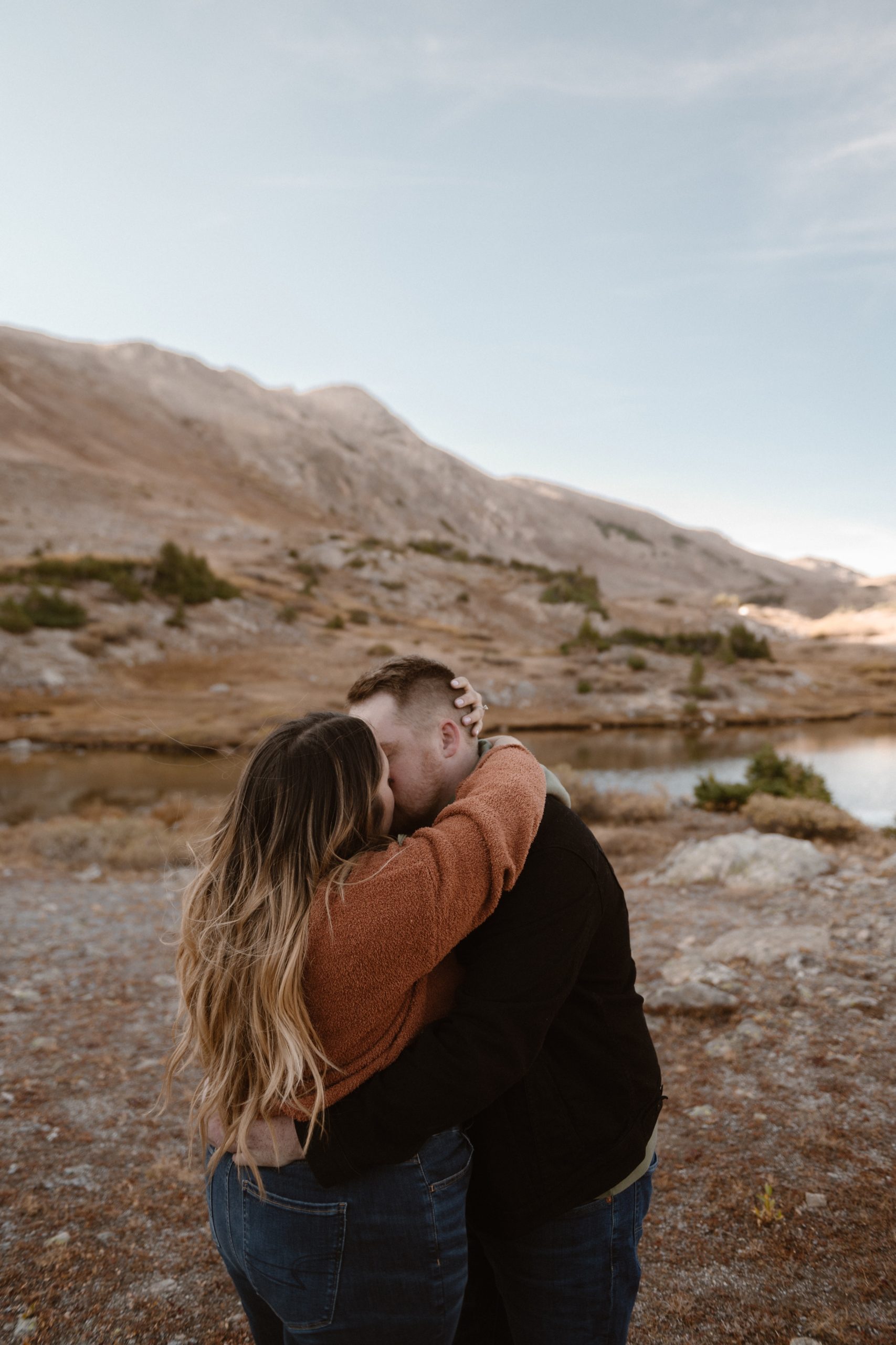 A Colorado engaged couple poses for their engagement photos at Loveland Pass, Colorado. Photos by Denver Elopement Photographer, Ashley Joyce Photography, 2022.