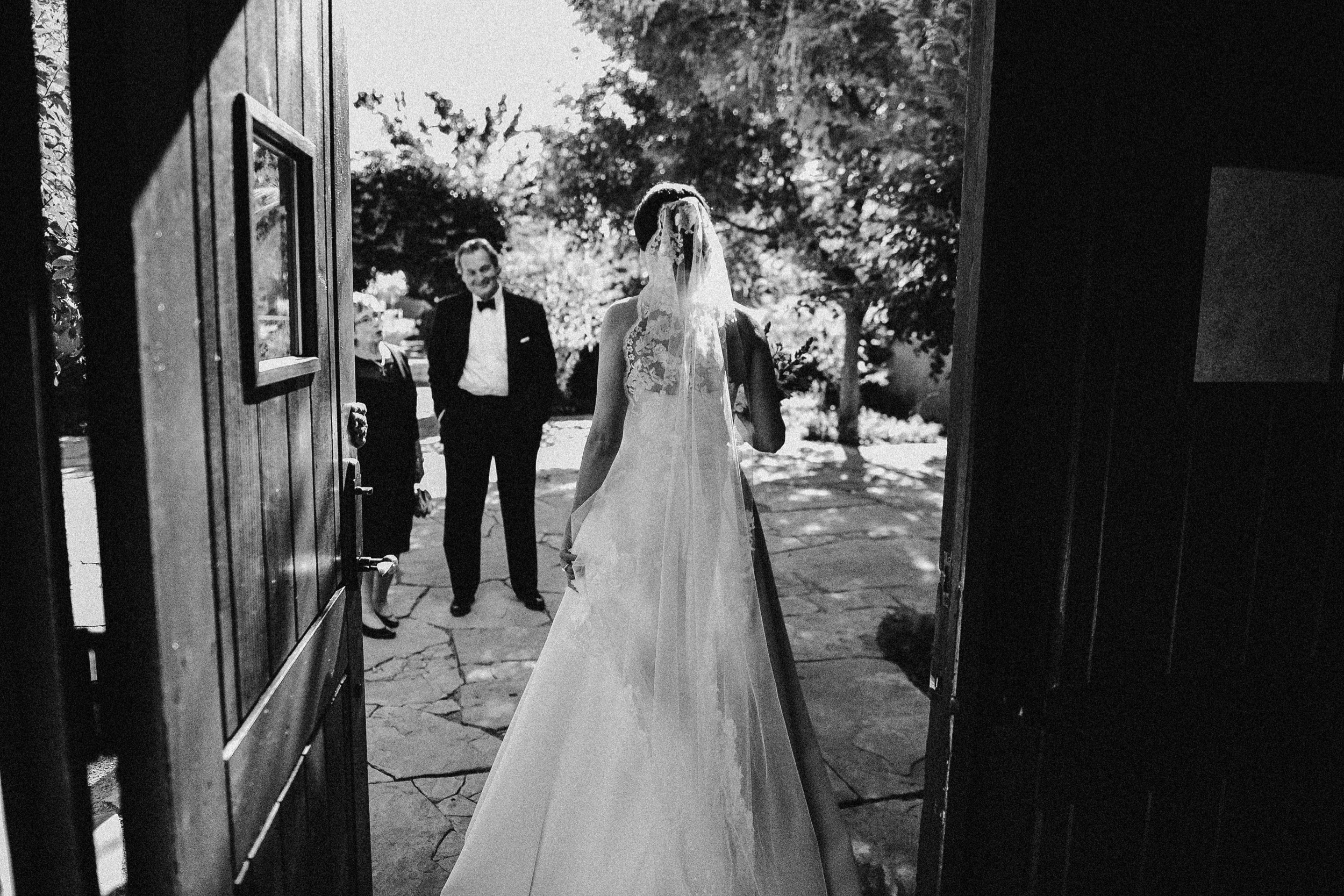 A New Mexico wedding couple poses for their Albuquerque fall wedding at Los Poblanos Historic Inn. Photo by New Mexico wedding photographer, Ashley Joyce Photography, copyright 2022.