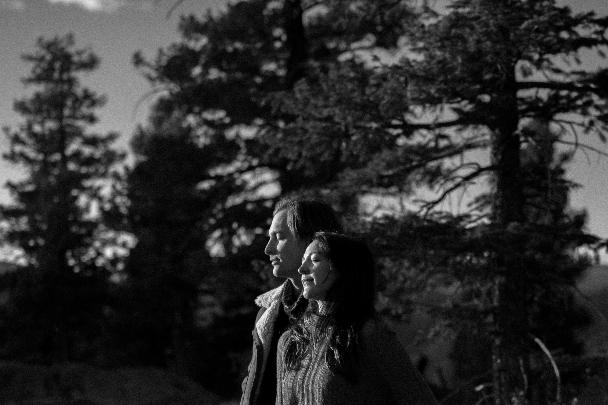 An engaged couple poses at sunrise for their Colorado Fall Mount Falcon Engagement Session. Photo by Denver Engagement photographer, Ashley Joyce Photography, copyright 2022.