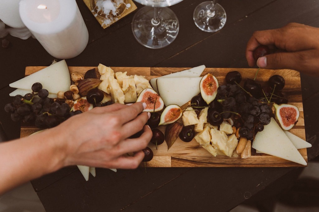 Charcuterie board detail with bride and groom | Reception details at Treehaus Colorado | Elopement at Treehaus, Colorado | Treehaus Colorado | Colorado elopement | Treehaus elopement | Colorado elopement venue | Colorado mountain elopement venue | Unique elopement venue | Elopement venue in Colorado | Ashley Joyce Photography 2020