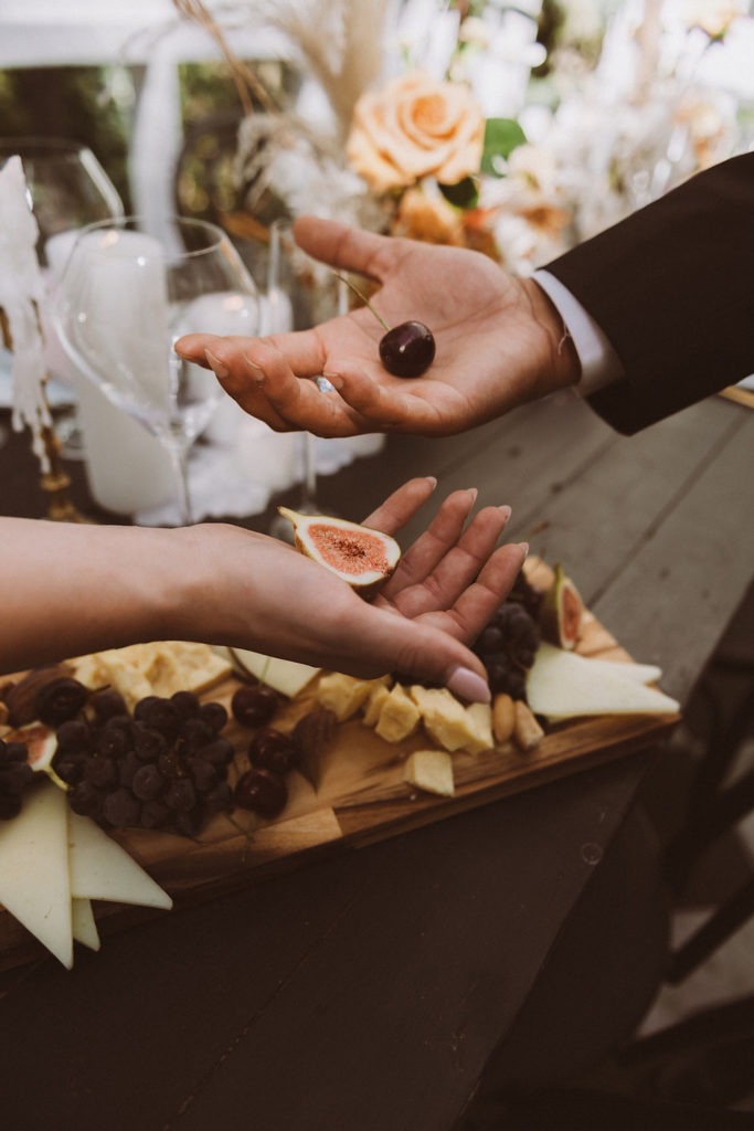 Charcuterie board detail with bride and groom | Reception details at Treehaus Colorado | Elopement at Treehaus, Colorado | Treehaus Colorado | Colorado elopement | Treehaus elopement | Colorado elopement venue | Colorado mountain elopement venue | Unique elopement venue | Elopement venue in Colorado | Ashley Joyce Photography 2020