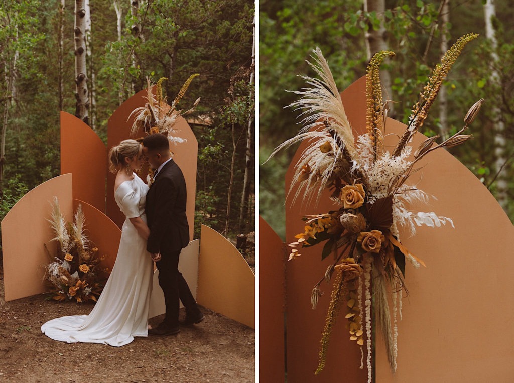 Bride and groom standing in front of a floral and wood arch in the forest | Floral arch detail | Elopement decor | Wedding decor | Wedding portraits | Elopement portraits | Bride and groom elopement photos | Elopement wedding photos in Colorado | Colorado wedding photos | Colorado elopement photos | Elopement at Treehaus, Colorado | Treehaus Colorado | Colorado elopement | Treehaus elopement | Colorado elopement venue | Colorado mountain elopement venue | Unique elopement venue | Elopement venue in Colorado | Ashley Joyce Photography 2020