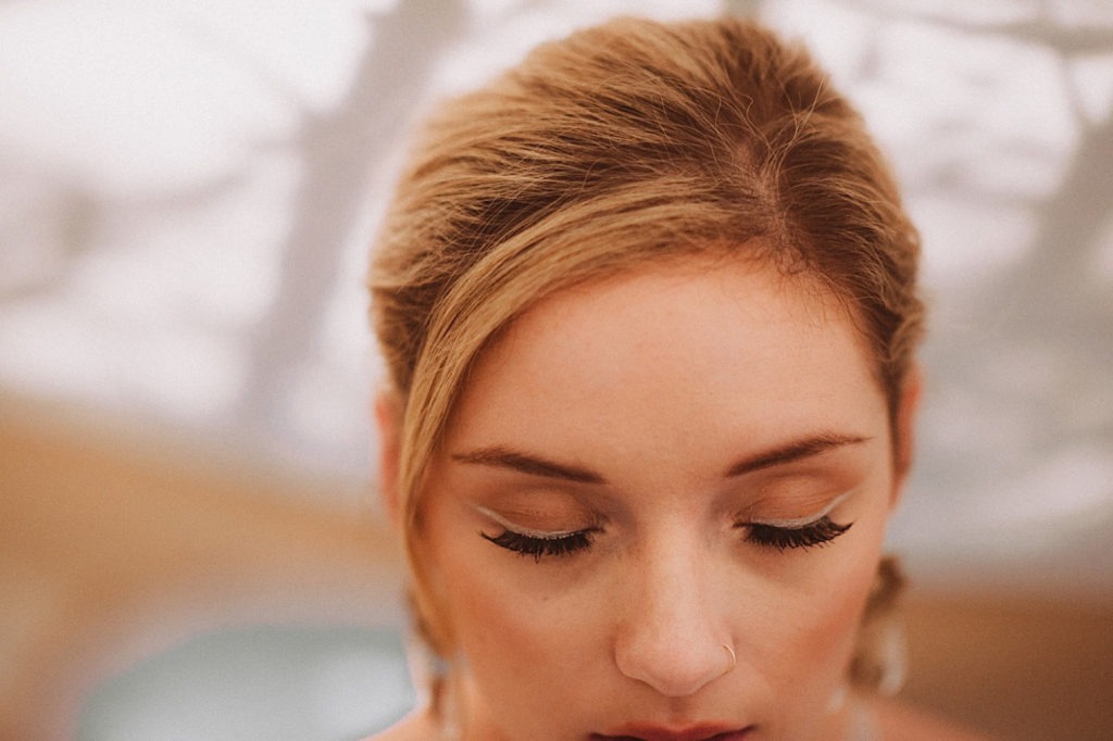 Bridal hair details | Bridal jewelry details | Bride showing crystal earrings | Bridal portraits | Wedding portraits | Elopement portraits | Bride and groom elopement photos | Elopement wedding photos in Colorado | Colorado wedding photos | Colorado elopement photos | Elopement at Treehaus, Colorado | Treehaus Colorado | Colorado elopement | Treehaus elopement | Colorado elopement venue | Colorado mountain elopement venue | Unique elopement venue | Elopement venue in Colorado | Ashley Joyce Photography 2020
