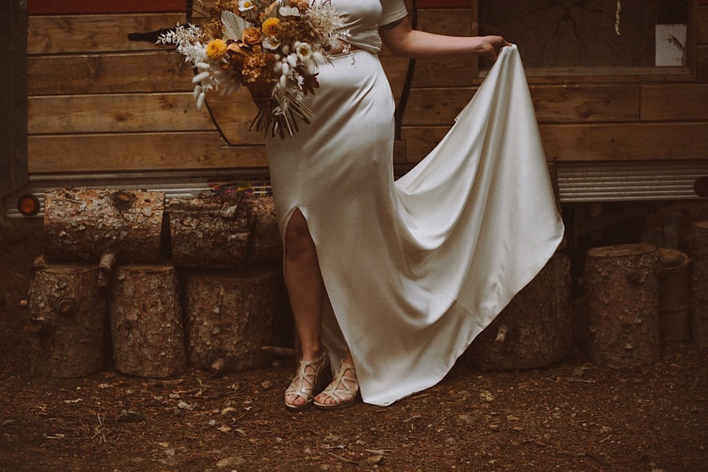Bride dancing in her wedding dress by Lovely Bride Denver | Bride dancing in her Prea James wedding dress | Colorado bride dancing in her dress | Wedding portraits | Elopement portraits | Bride and groom elopement photos | Elopement wedding photos in Colorado | Colorado wedding photos | Colorado elopement photos | Elopement at Treehaus, Colorado | Treehaus Colorado | Colorado elopement | Treehaus elopement | Colorado elopement venue | Colorado mountain elopement venue | Unique elopement venue | Elopement venue in Colorado | Ashley Joyce Photography 2020