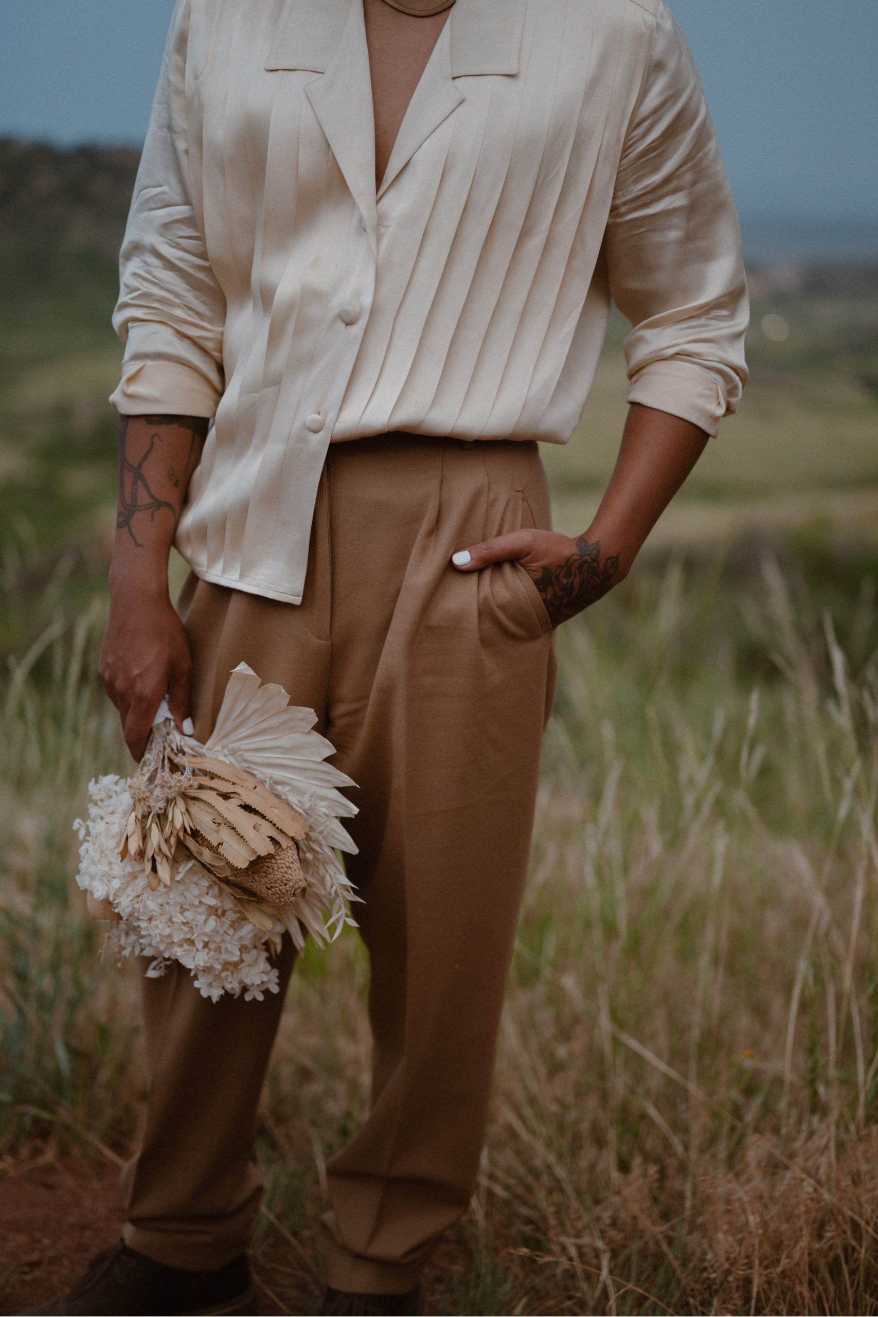 Colorado vow renewal in Morrison, Colorado. A Colorado married couple performs their vow renewal on a sunny summer day near Denver, Colorado. Photos by Denver elopement photographer, Ashley Joyce Photography, copyright 2022.