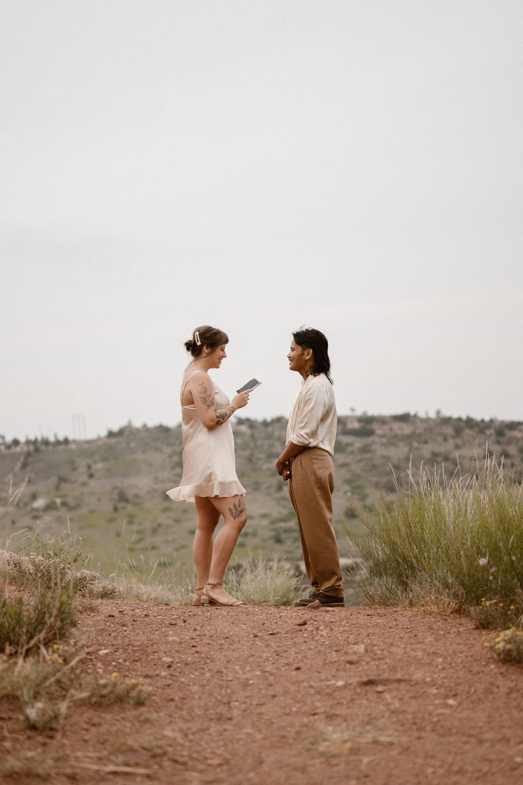 Colorado vow renewal in Morrison, Colorado. A Colorado married couple performs their vow renewal on a sunny summer day near Denver, Colorado. Photos by Denver elopement photographer, Ashley Joyce Photography, copyright 2022.