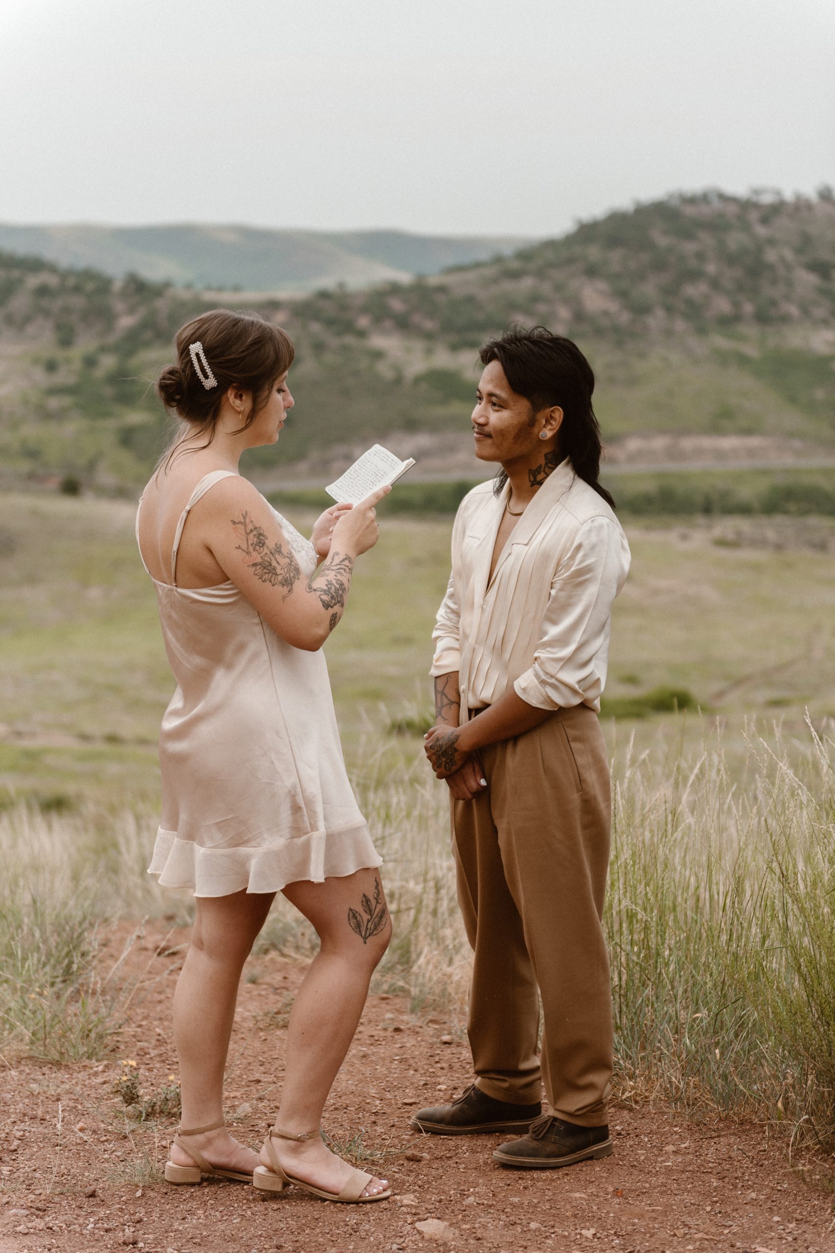 Colorado vow renewal in Morrison, Colorado. A Colorado married couple performs their vow renewal on a sunny summer day near Denver, Colorado. Photos by Denver elopement photographer, Ashley Joyce Photography, copyright 2022.