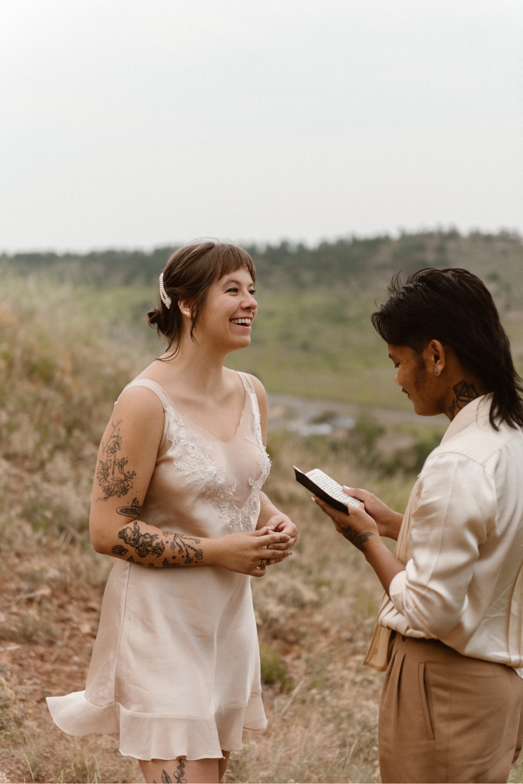 Colorado vow renewal in Morrison, Colorado. A Colorado married couple performs their vow renewal on a sunny summer day near Denver, Colorado. Photos by Denver elopement photographer, Ashley Joyce Photography, copyright 2022.