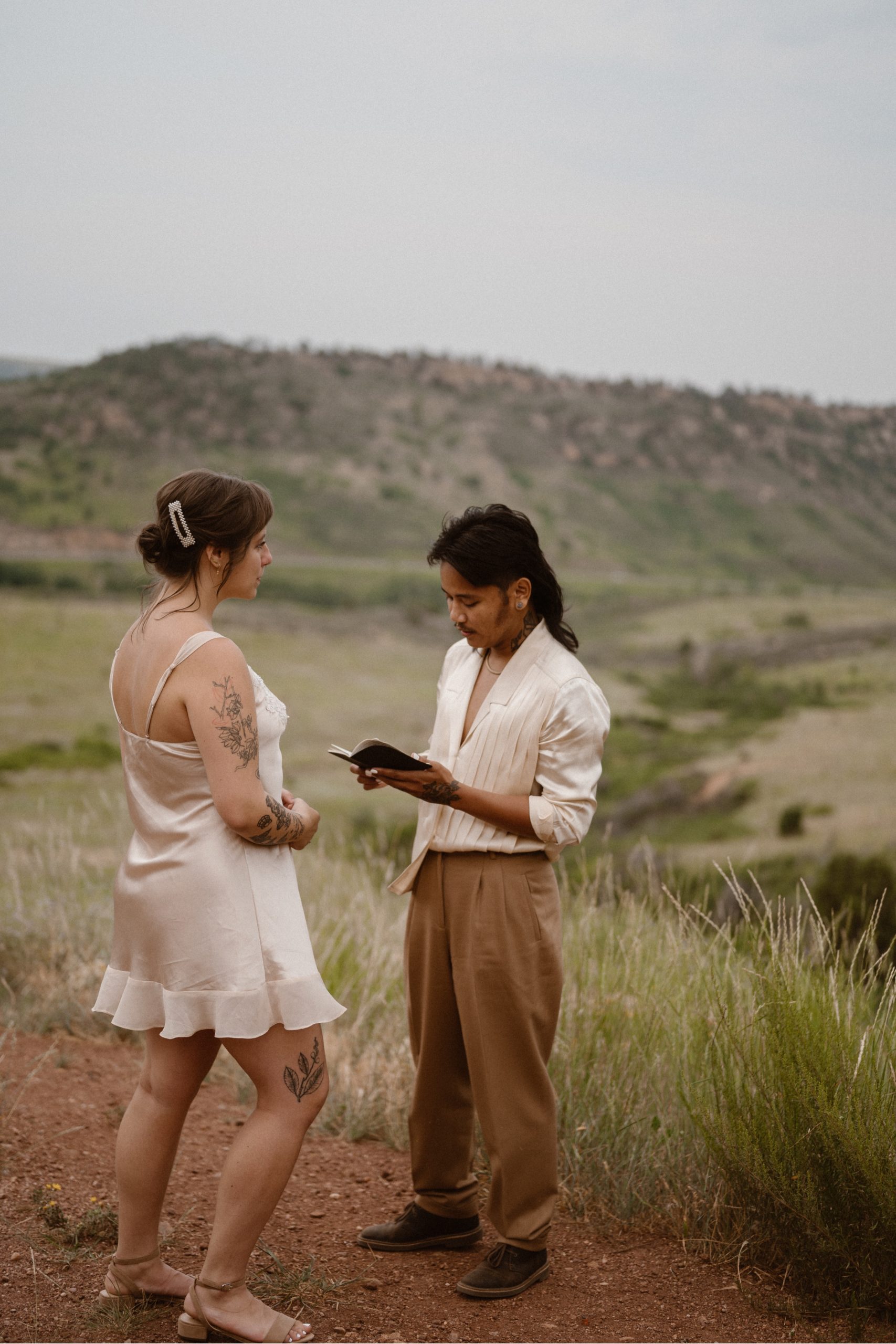 Colorado vow renewal in Morrison, Colorado. A Colorado married couple performs their vow renewal on a sunny summer day near Denver, Colorado. Photos by Denver elopement photographer, Ashley Joyce Photography, copyright 2022.