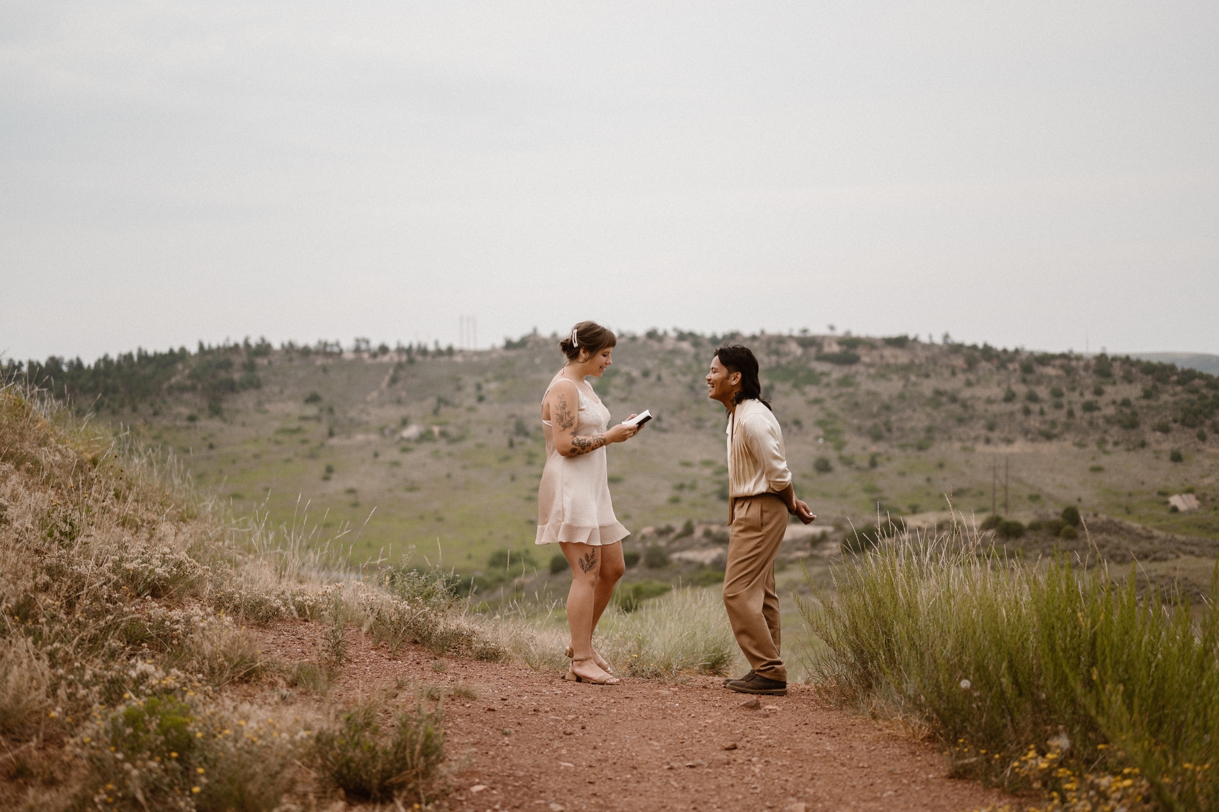 Colorado vow renewal in Morrison, Colorado. A Colorado married couple performs their vow renewal on a sunny summer day near Denver, Colorado. Photos by Denver elopement photographer, Ashley Joyce Photography, copyright 2022.