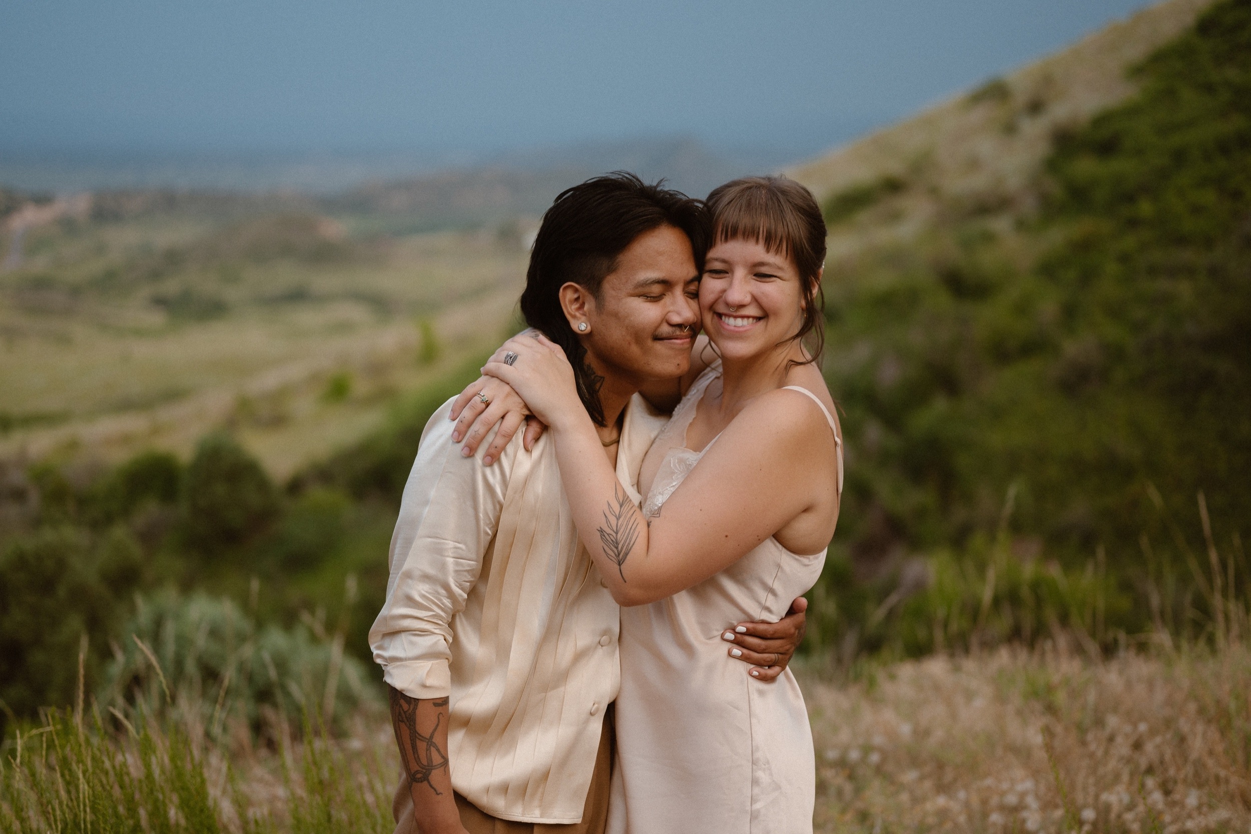 Colorado vow renewal in Morrison, Colorado. A Colorado married couple performs their vow renewal on a sunny summer day near Denver, Colorado. Photos by Denver elopement photographer, Ashley Joyce Photography, copyright 2022.