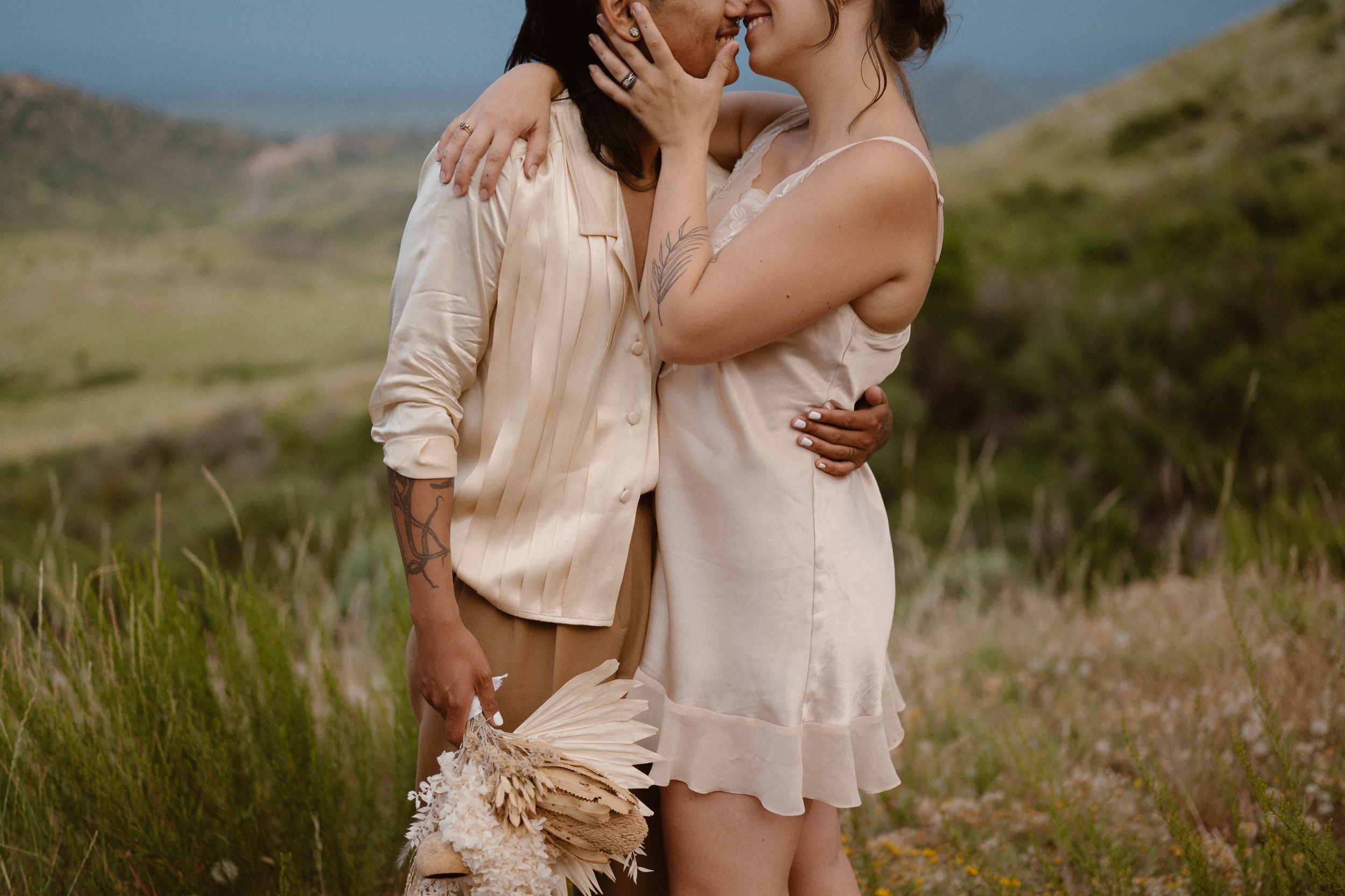 Colorado vow renewal in Morrison, Colorado. A Colorado married couple performs their vow renewal on a sunny summer day near Denver, Colorado. Photos by Denver elopement photographer, Ashley Joyce Photography, copyright 2022.