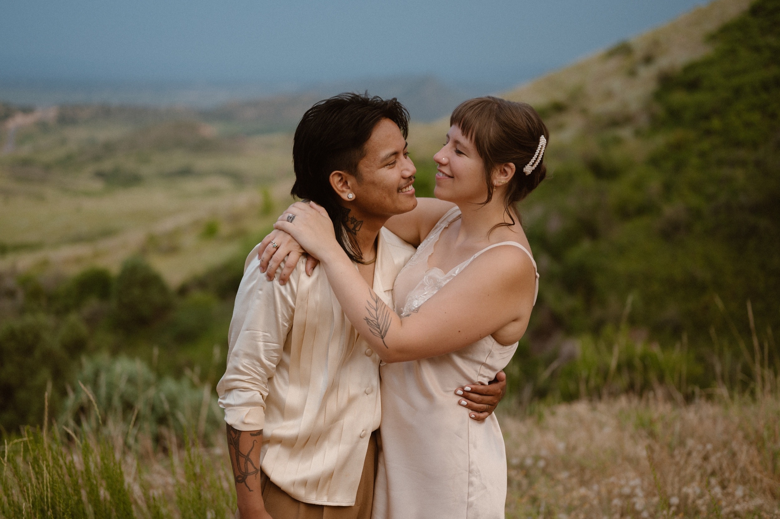Colorado vow renewal in Morrison, Colorado. A Colorado married couple performs their vow renewal on a sunny summer day near Denver, Colorado. Photos by Denver elopement photographer, Ashley Joyce Photography, copyright 2022.