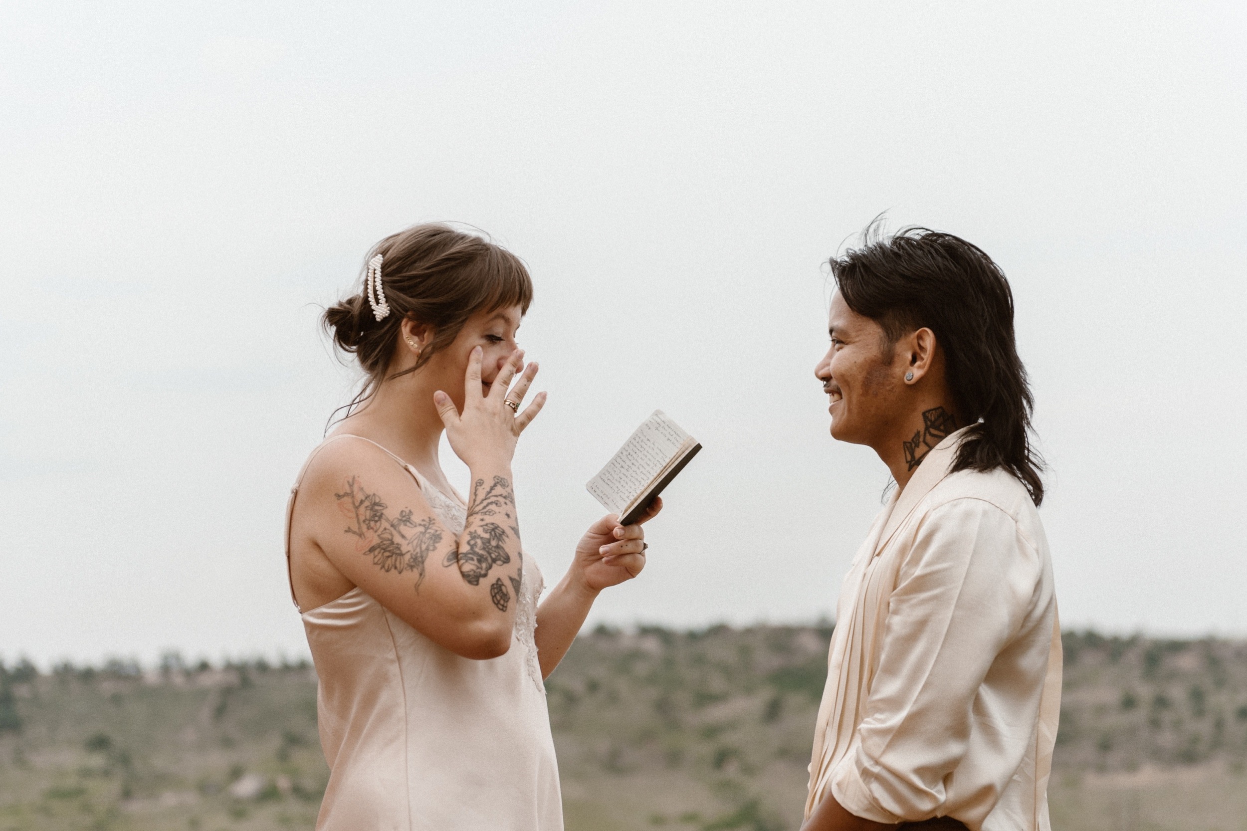Colorado vow renewal in Morrison, Colorado. A Colorado married couple performs their vow renewal on a sunny summer day near Denver, Colorado. Photos by Denver elopement photographer, Ashley Joyce Photography, copyright 2022.