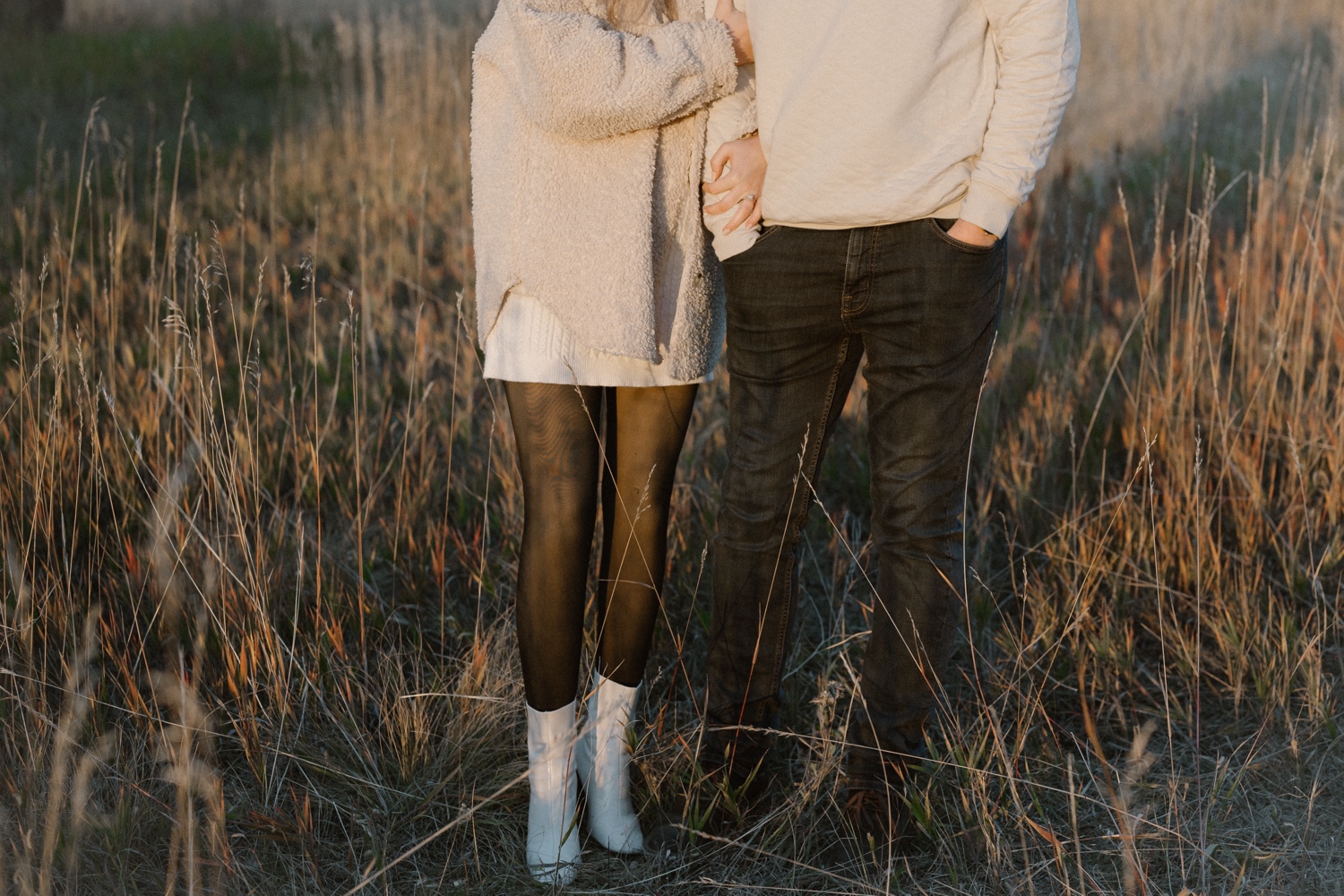A photo of an engaged couple walking through Elk Meadow Park in Evergreen, Colorado for their Colorado engagement photos, taken by Colorado wedding photographer Ashley Joyce Photography.