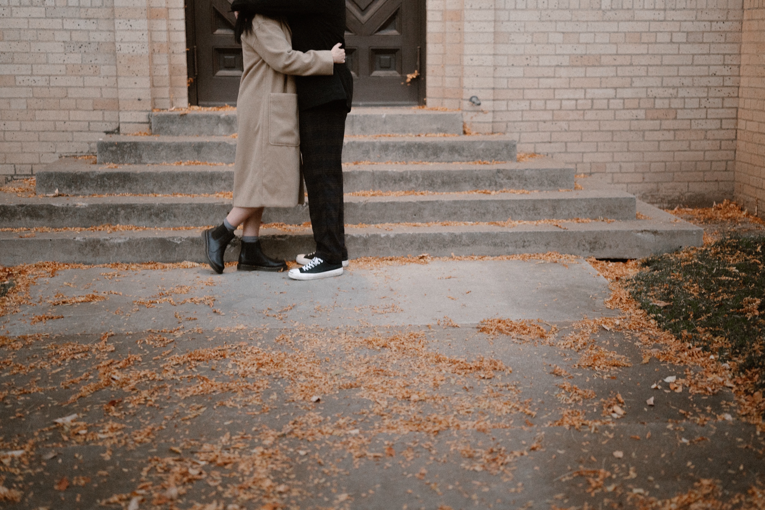 A photo of a couple's lower half of their body while they embrace each other for their Colorado engagement session in Durango. Photo by Ashley Joyce.