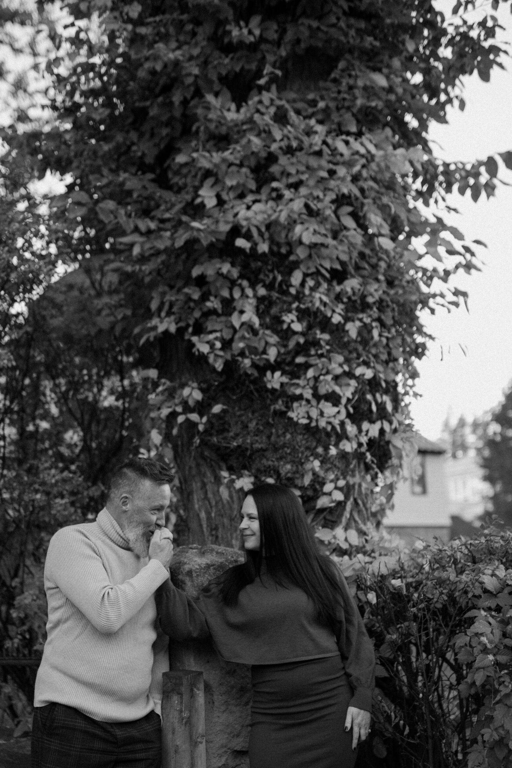 A black and white photo of an engaged couple posing together for their Durango Colorado engagement session, taken by Colorado wedding photographer, Ashley Joyce.