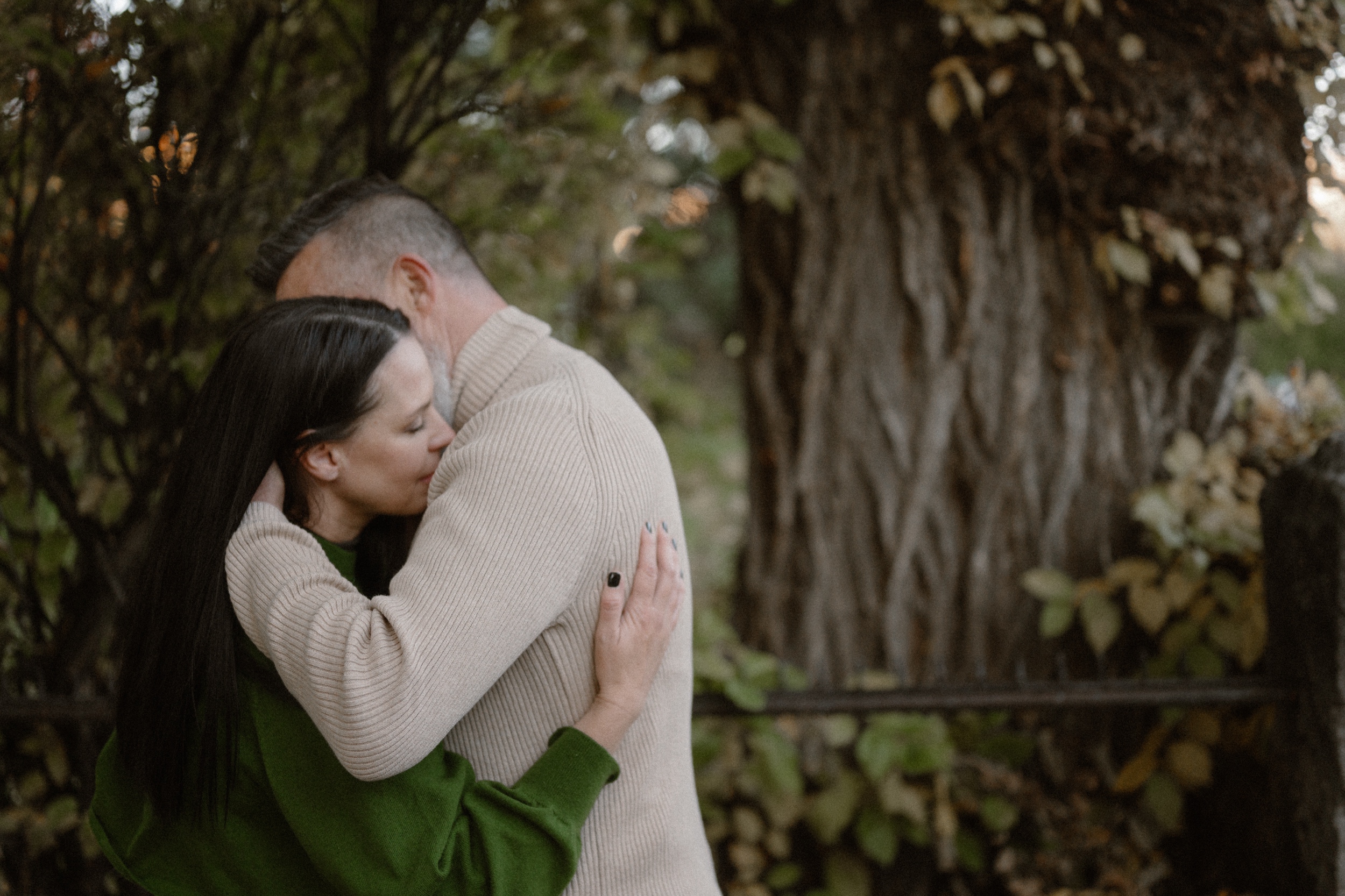 A color photo of an engaged couple intimately hugging one another for their Durango Colorado engagement session, taken by Colorado wedding photographer, Ashley Joyce.