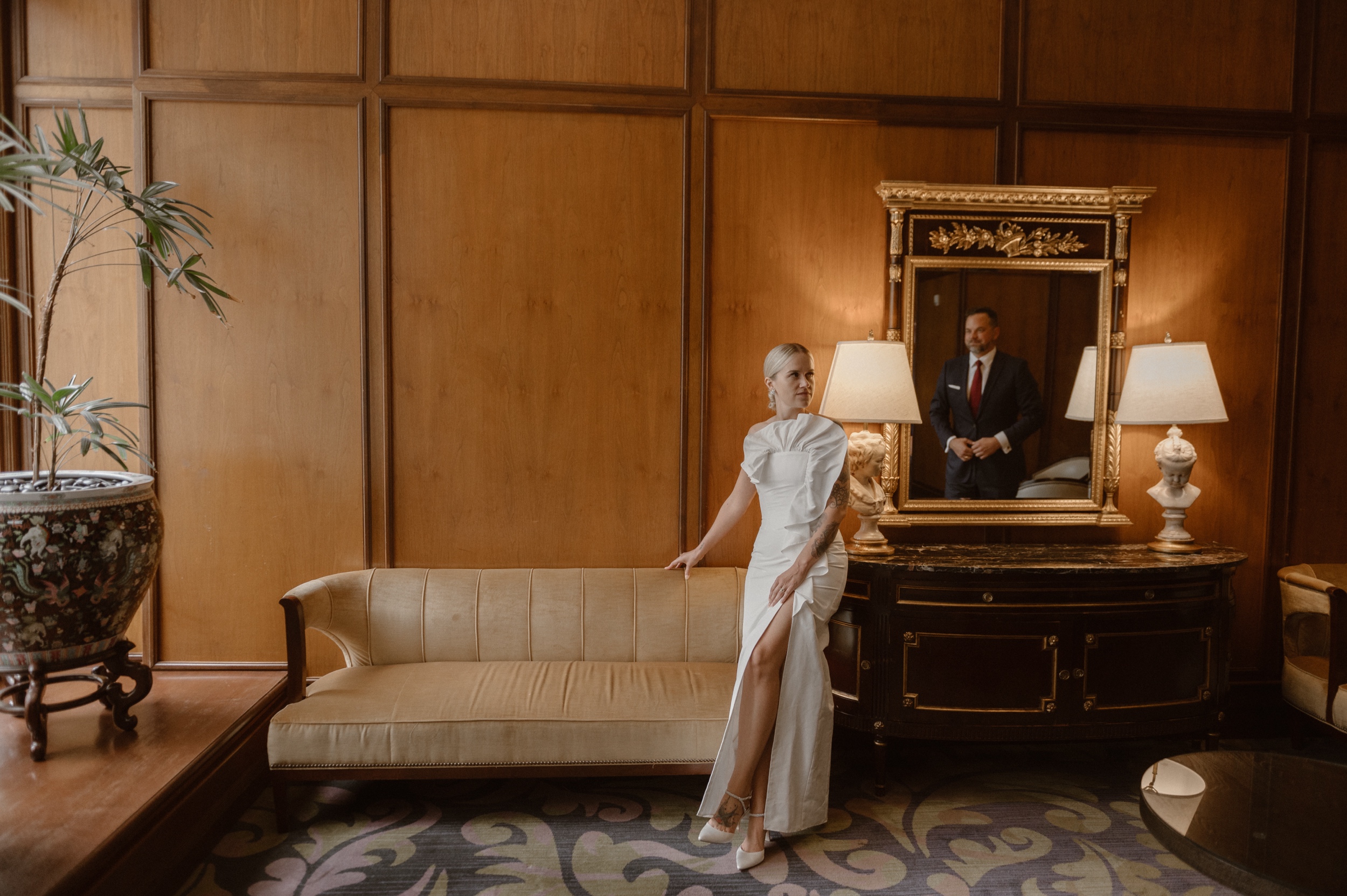 A bride and groom pose for their wedding portraits at the Brown Palace in Denver Colorado. Photo by Colorado wedding photographer Ashley Joyce.