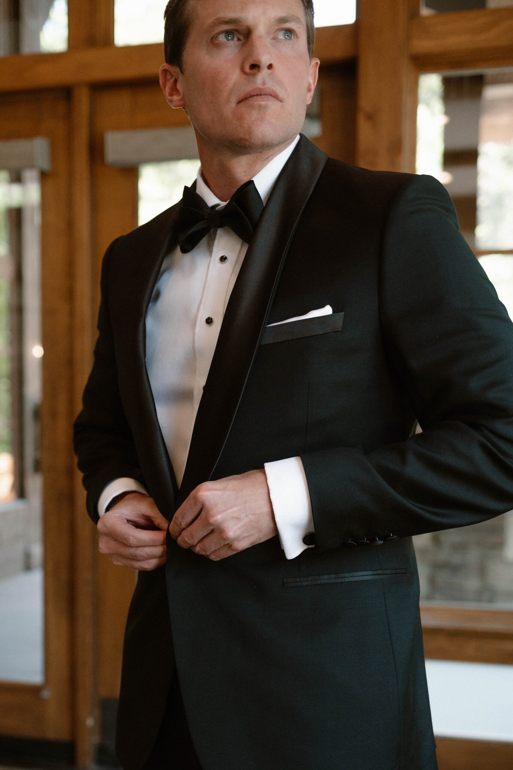 A groom getting ready for his wedding at Donovan Pavilion in Vail, Colorado. Photo by Colorado wedding photographer, Ashley Joyce.