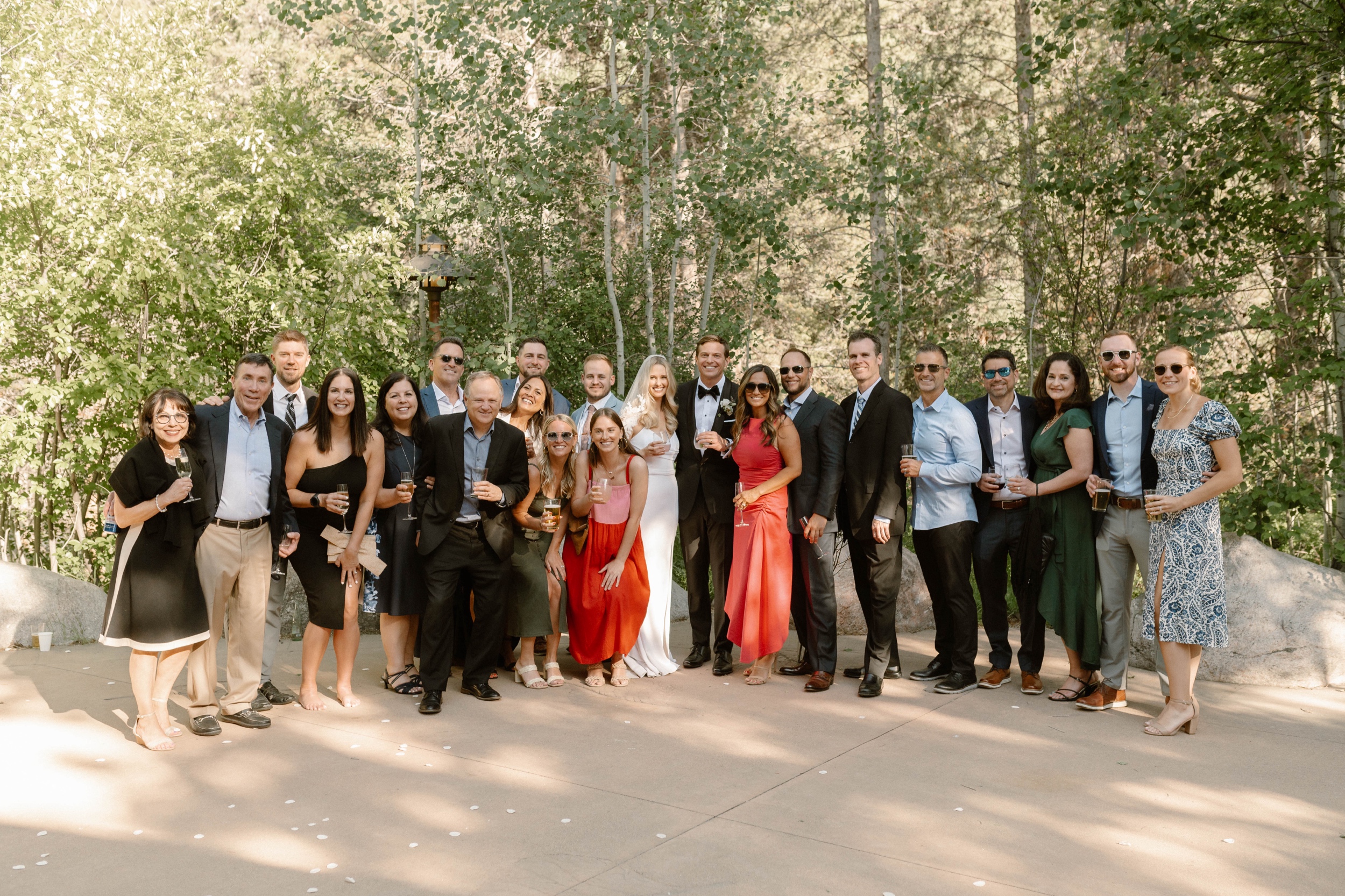 Candid wedding photos of guests at a wedding in Vail, Colorado. Photo by Colorado wedding photographer Ashley Joyce.