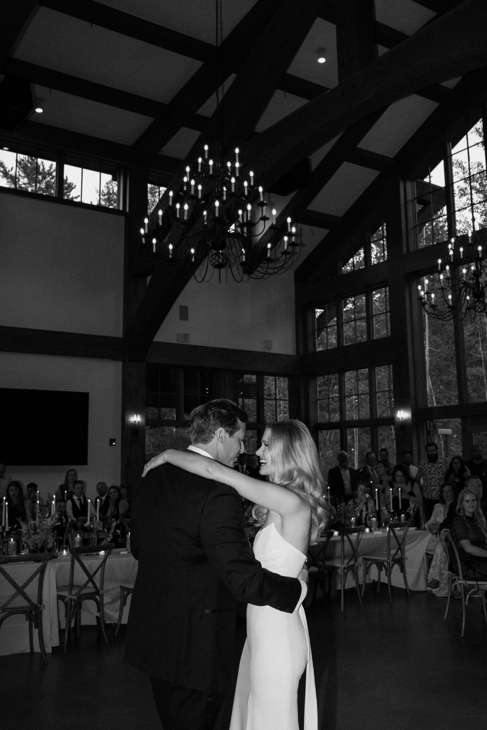 A bride and groom dance to their first dance at their wedding in Vail, Colorado. Photo by Colorado wedding photographer Ashley Joyce.