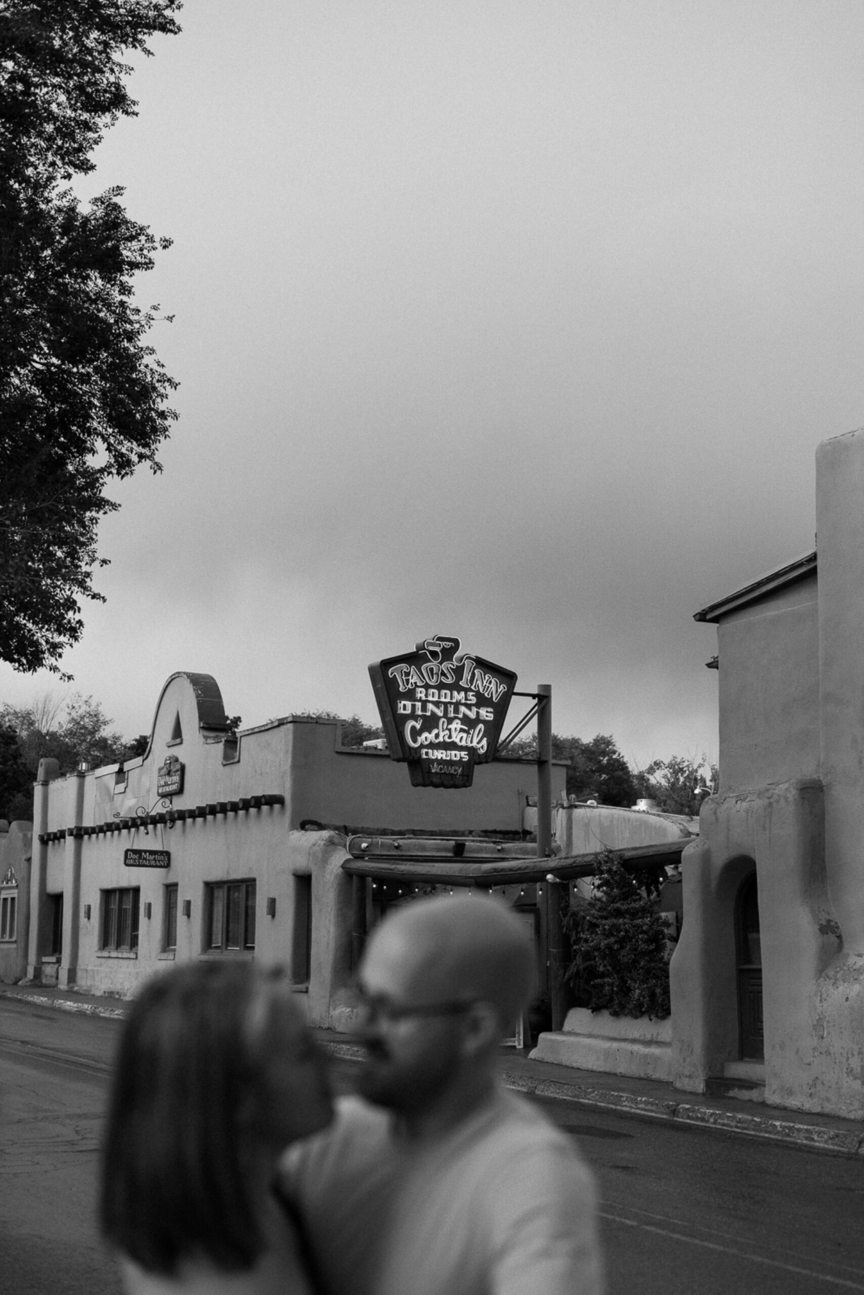 Engagement photos taken in downtown Taos, New Mexico. Photos by Telluride wedding photographer Ashley Joyce Photography.