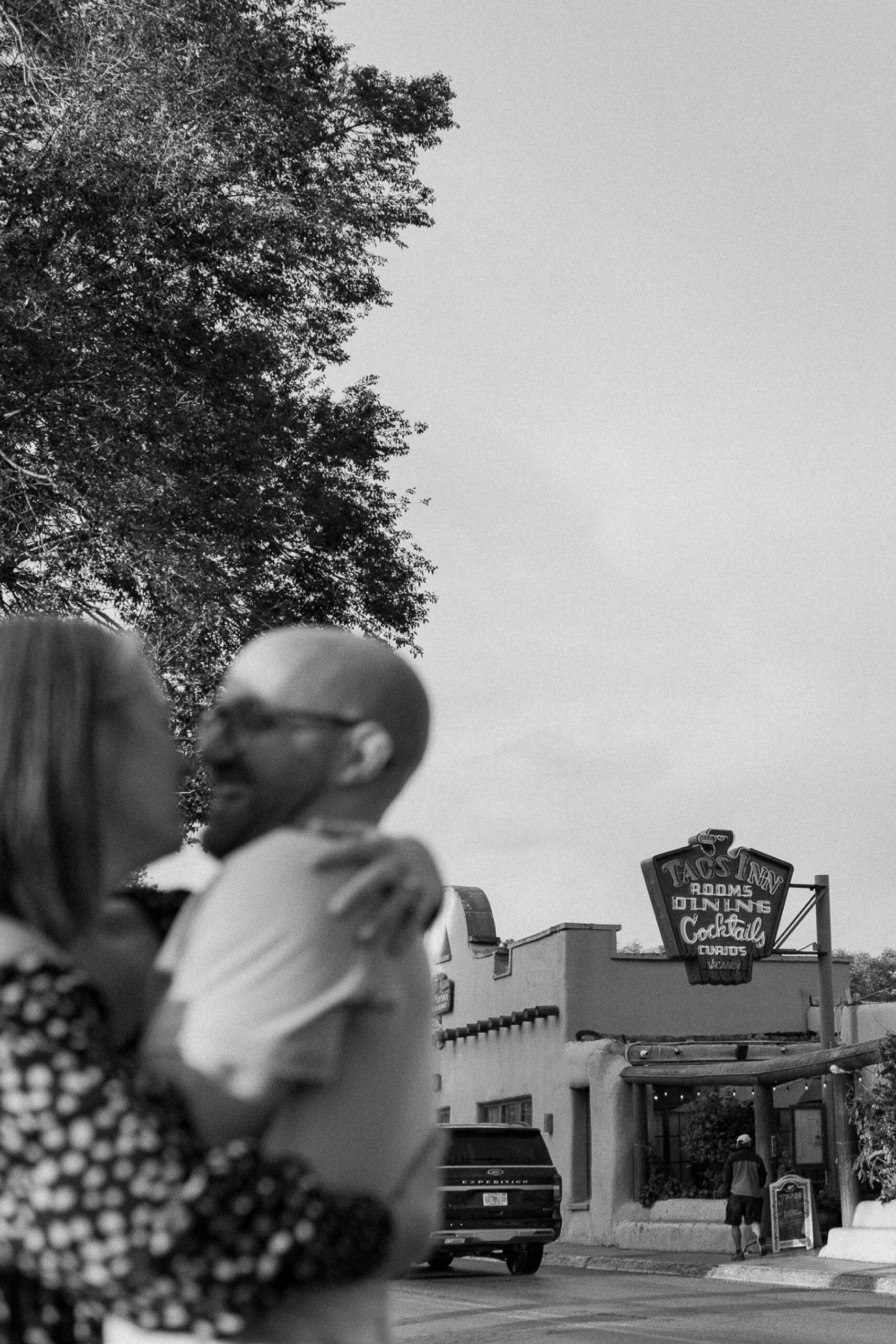 Engagement photos taken in downtown Taos, New Mexico. Photos by Telluride wedding photographer Ashley Joyce Photography.