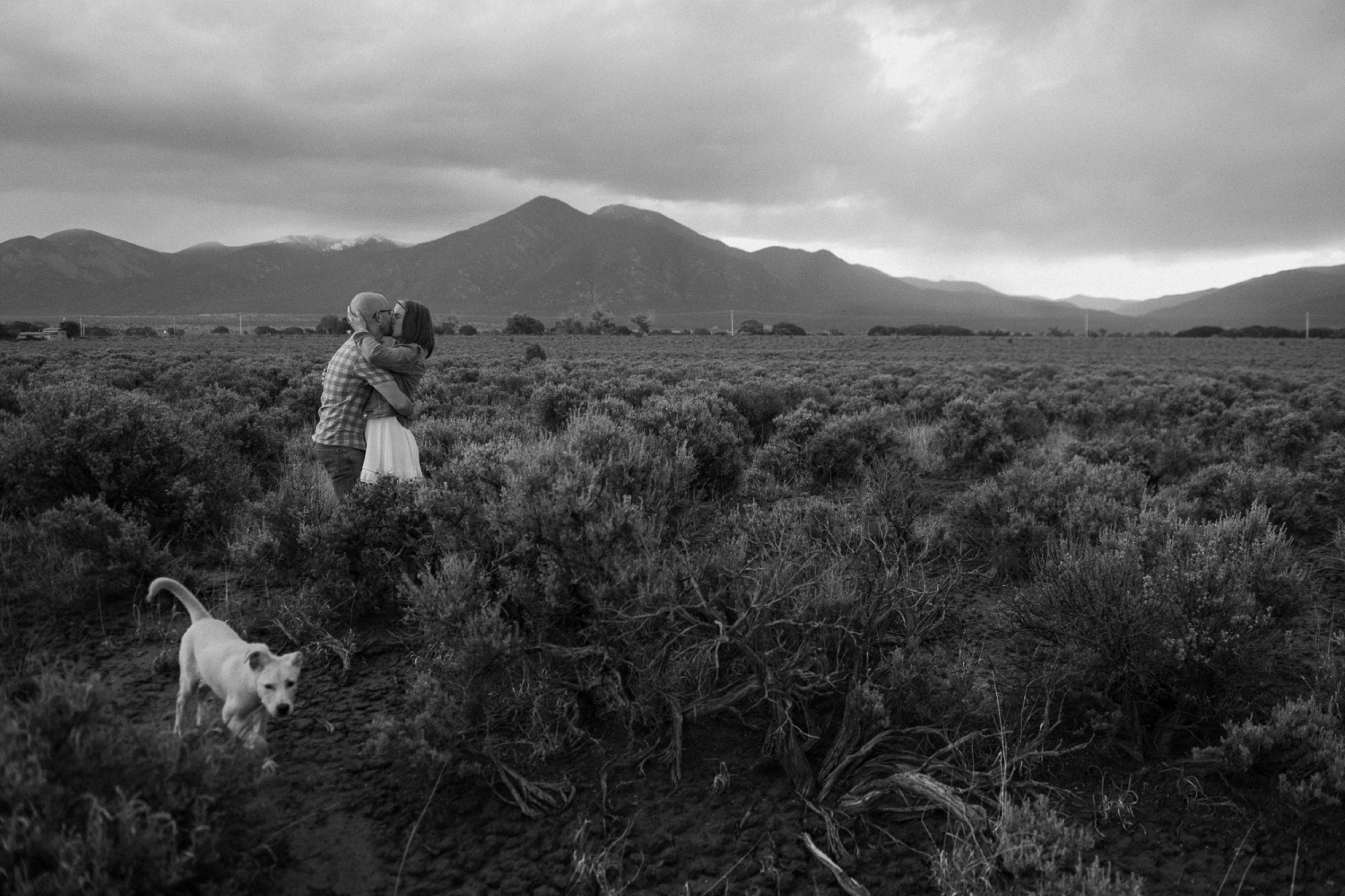 Engagement photos taken in downtown Taos, New Mexico. Photos by Telluride wedding photographer Ashley Joyce Photography.