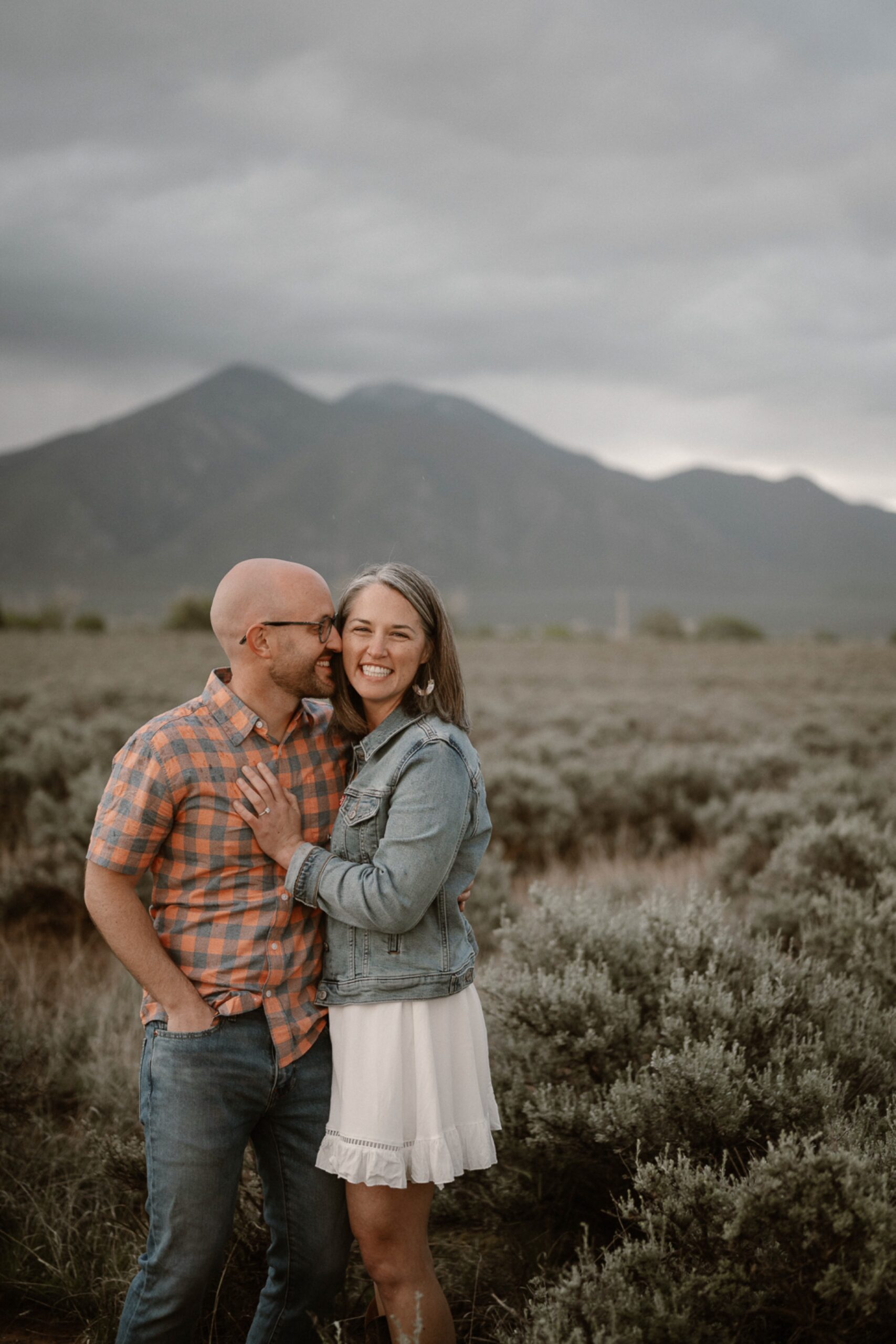 Engagement photos taken in downtown Taos, New Mexico. Photos by Telluride wedding photographer Ashley Joyce Photography.