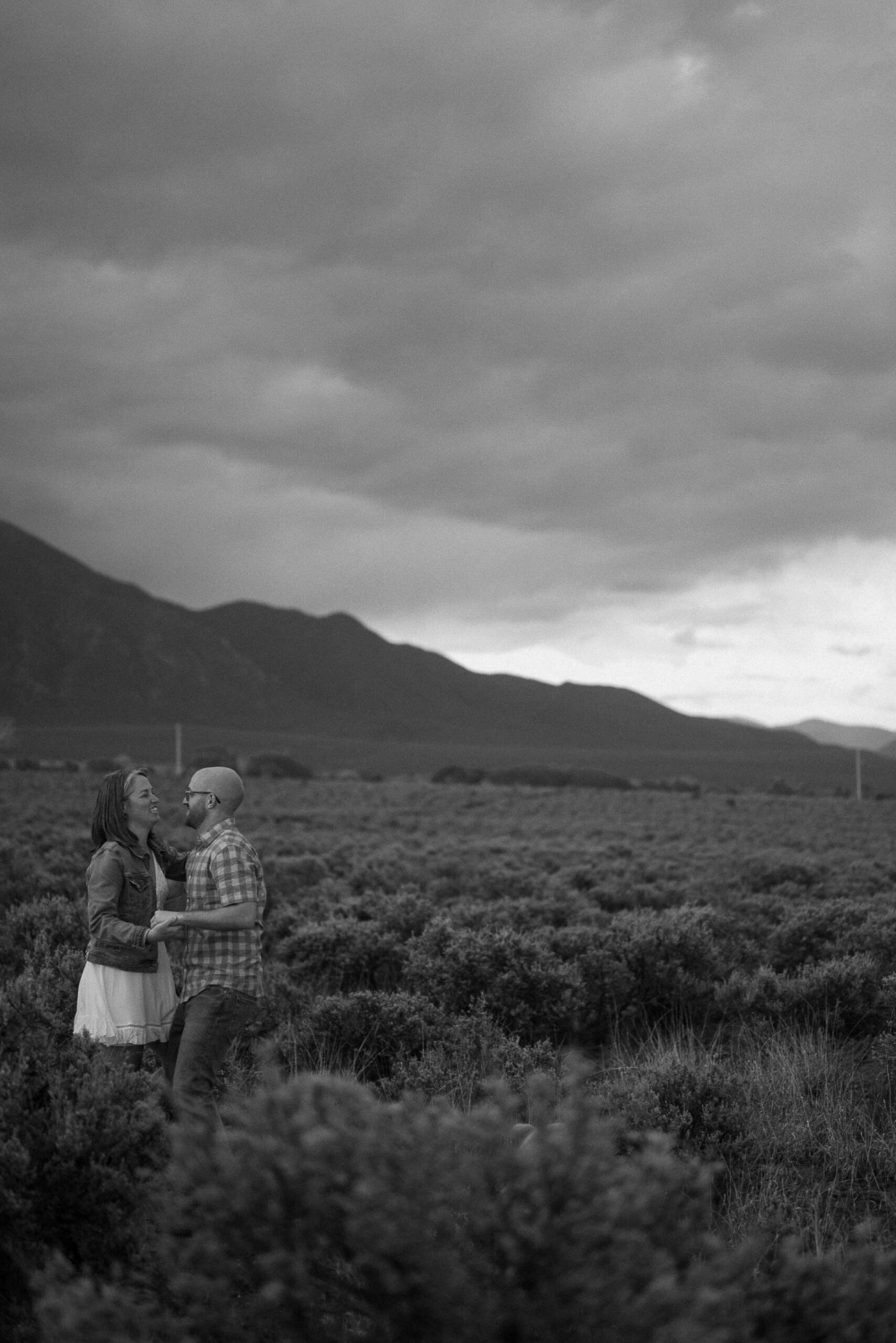 Engagement photos taken in downtown Taos, New Mexico. Photos by Telluride wedding photographer Ashley Joyce Photography.