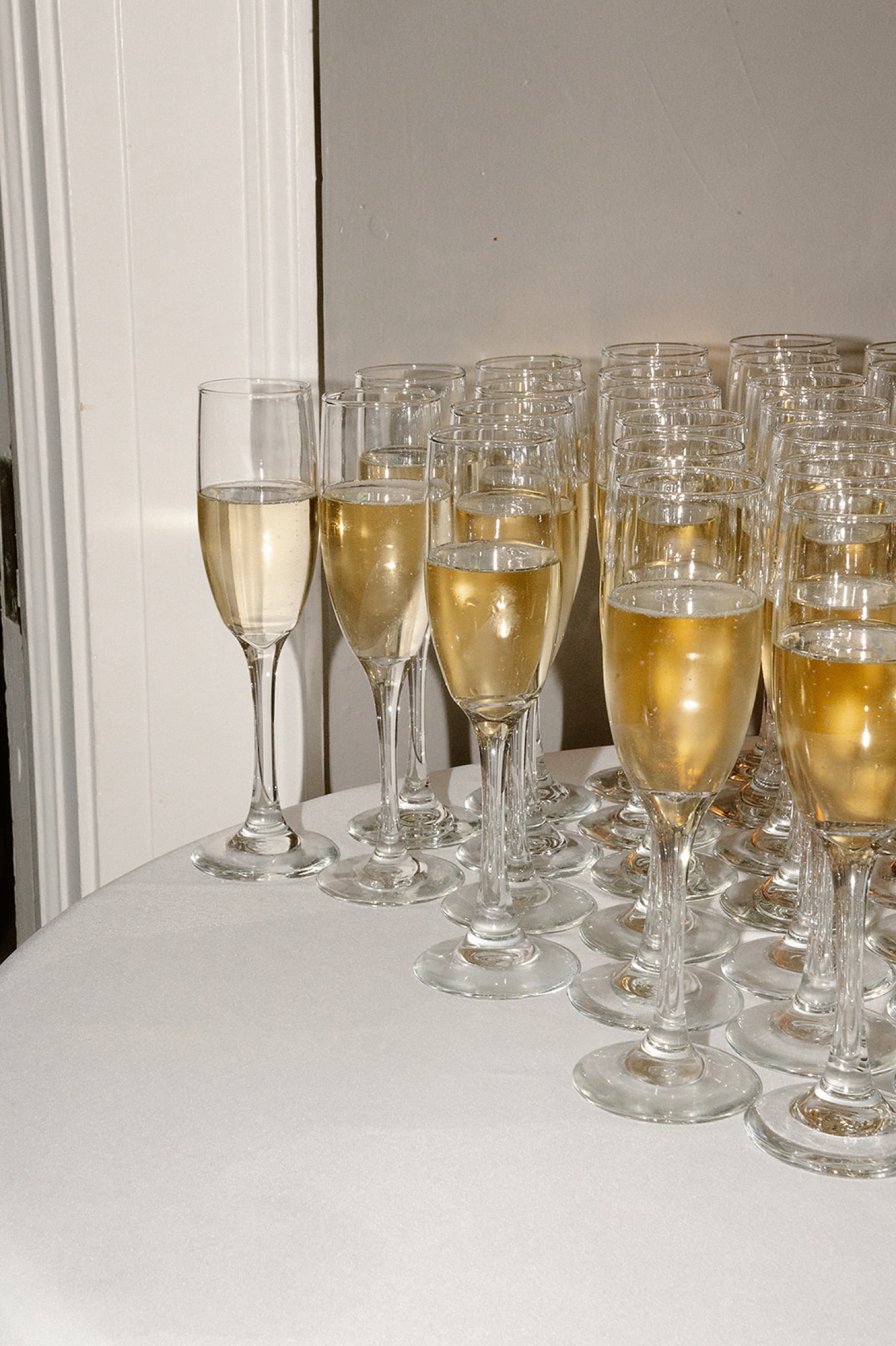 A photo of champagne in champagne flutes