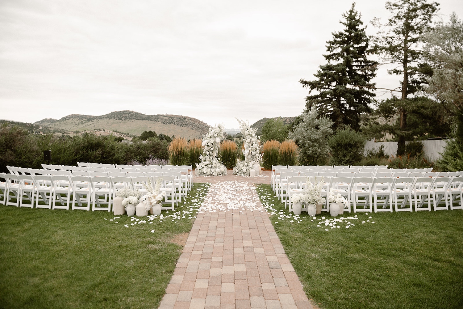 An empty ceremony site at the garden at The Manor House wedding venue in Littleton, Colorado