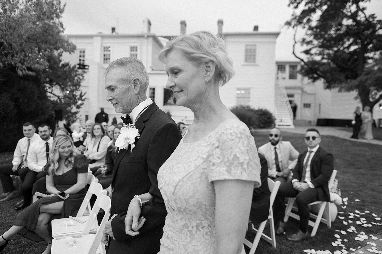 Wedding guests walking down the aisle