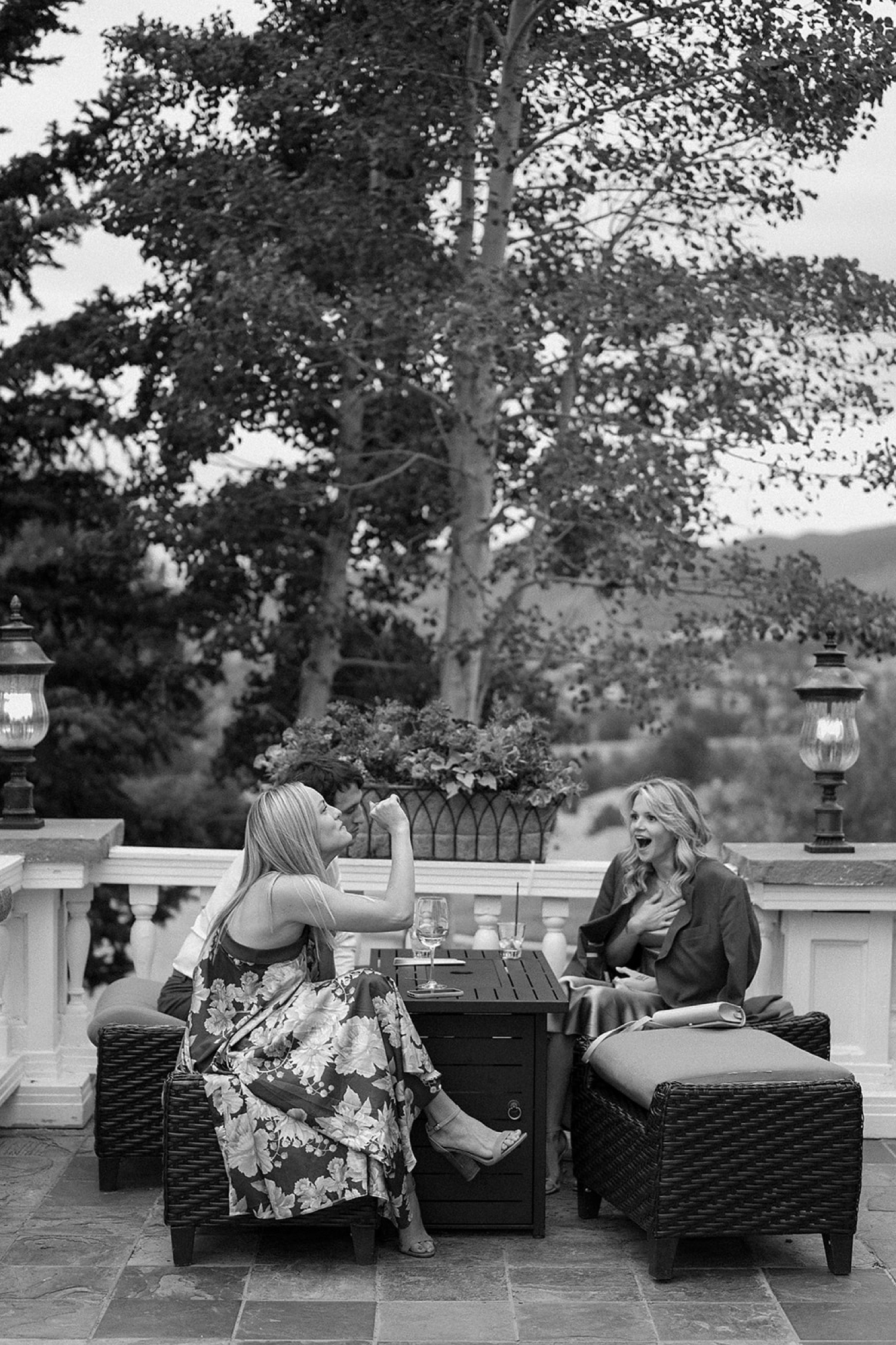 Wedding guest laugh together during cocktail hour